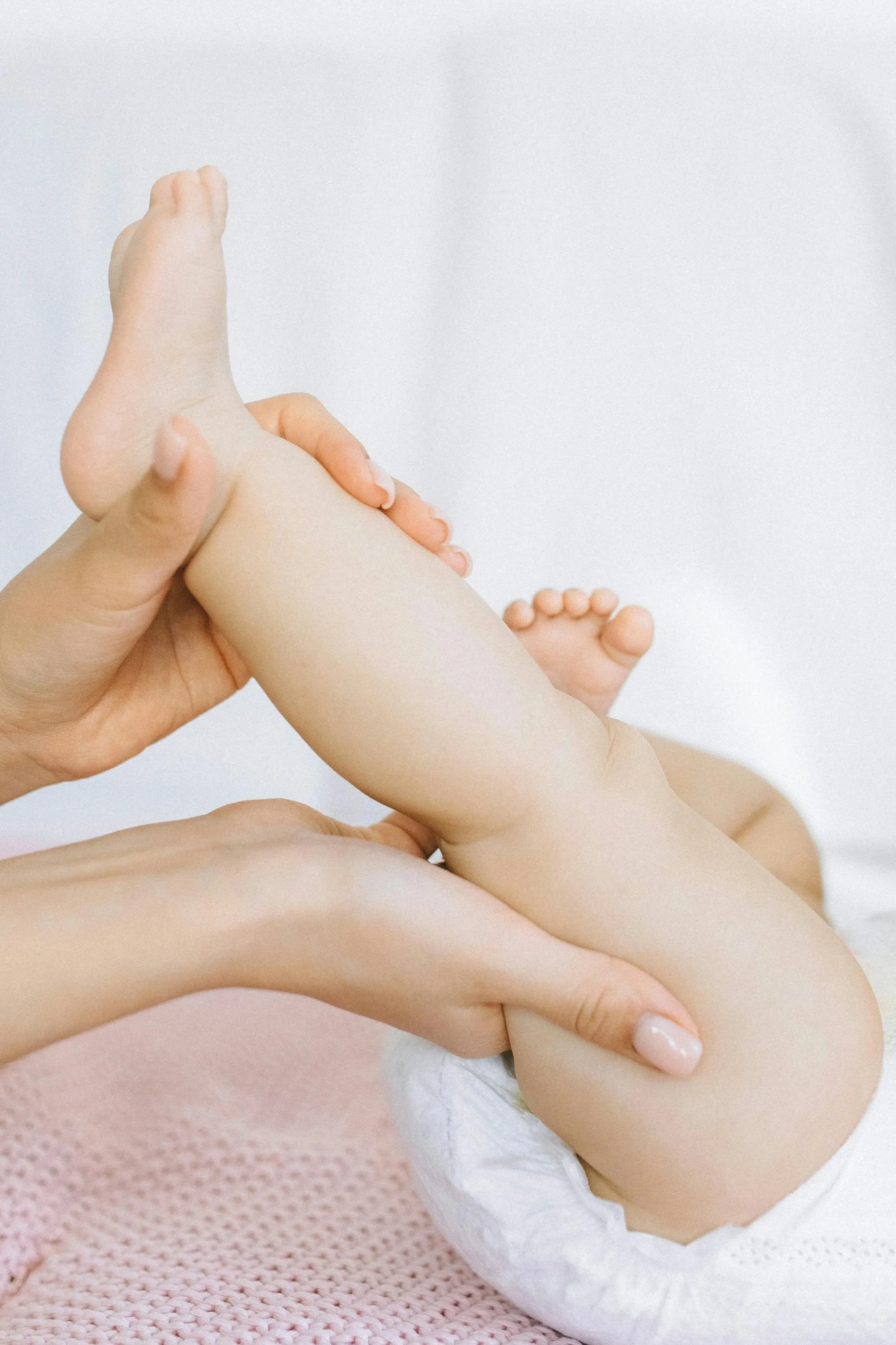 Infant receiving gentle therapeutic massage in Lake Charles