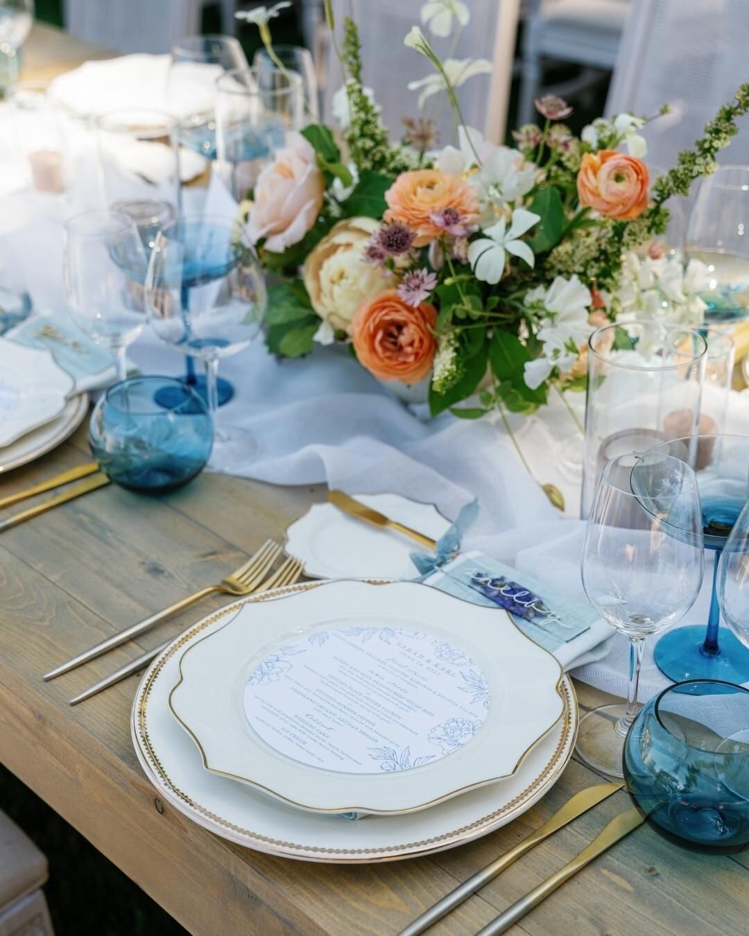 Using Sarah's dress design as our inspiration for color palette, we melded soft peaches, corals and cream with tasteful touches of blues to create a mouthwatering feast for the eyes.

#weddingtable #weddingreception #weddingcolors #weddingplanner #lu