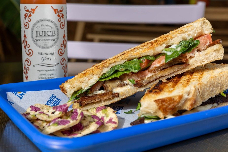 Enjoy our Tofu Lettuce Tomato sandwich with a refreshing @pittsburghjuice for a perfect meal! ☀️