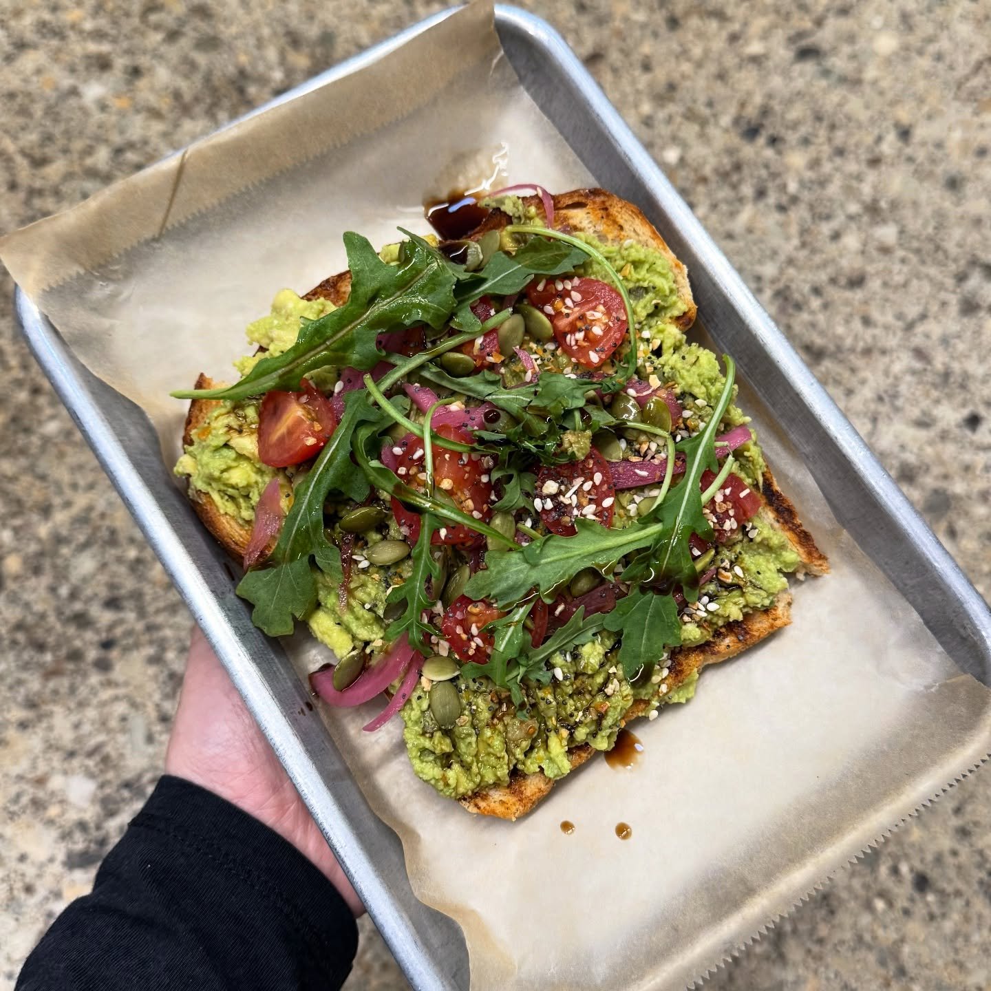 It&rsquo;s an avocado toast kinda day! Avocado, tomato, arugula, pickled onions, pepitas, everything seasoning, and a drizzle of balsamic. Served on sourdough or Heartland grain bread 🥑✨

Come get yourself a slice! Available in store or order online