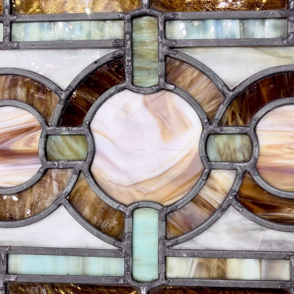 Green and Gold Stained Glass Window with Interwoven Loops and Gold Leafed Frame - Aurora Mills