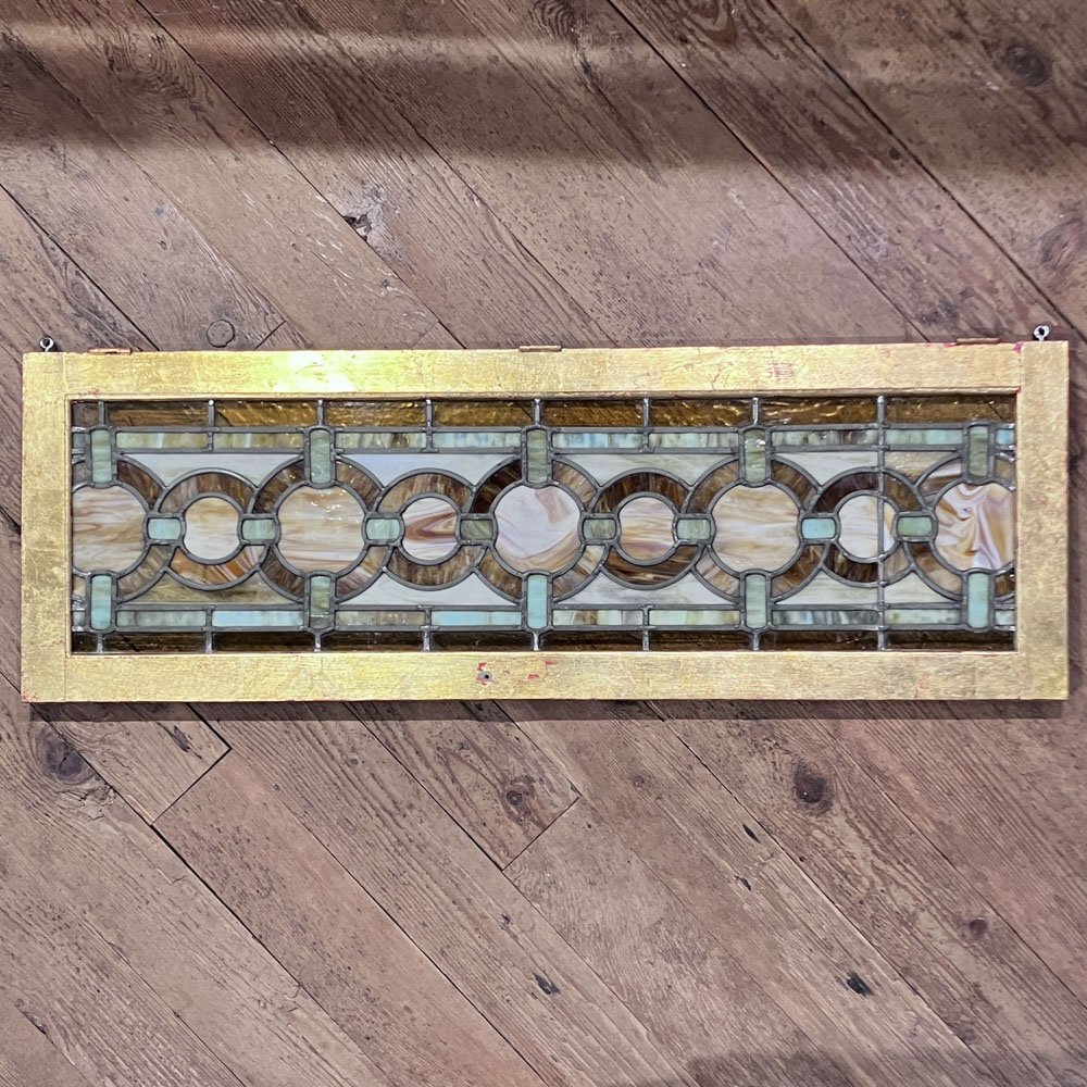 Green and Gold Stained Glass Window with Interwoven Loops and Gold Leafed Frame - Aurora Mills