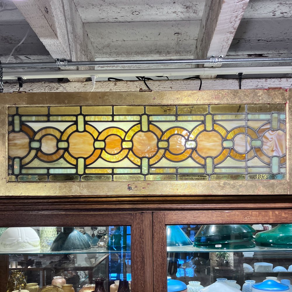 Green and Gold Stained Glass Window with Interwoven Loops and Gold Leafed Frame - Aurora Mills