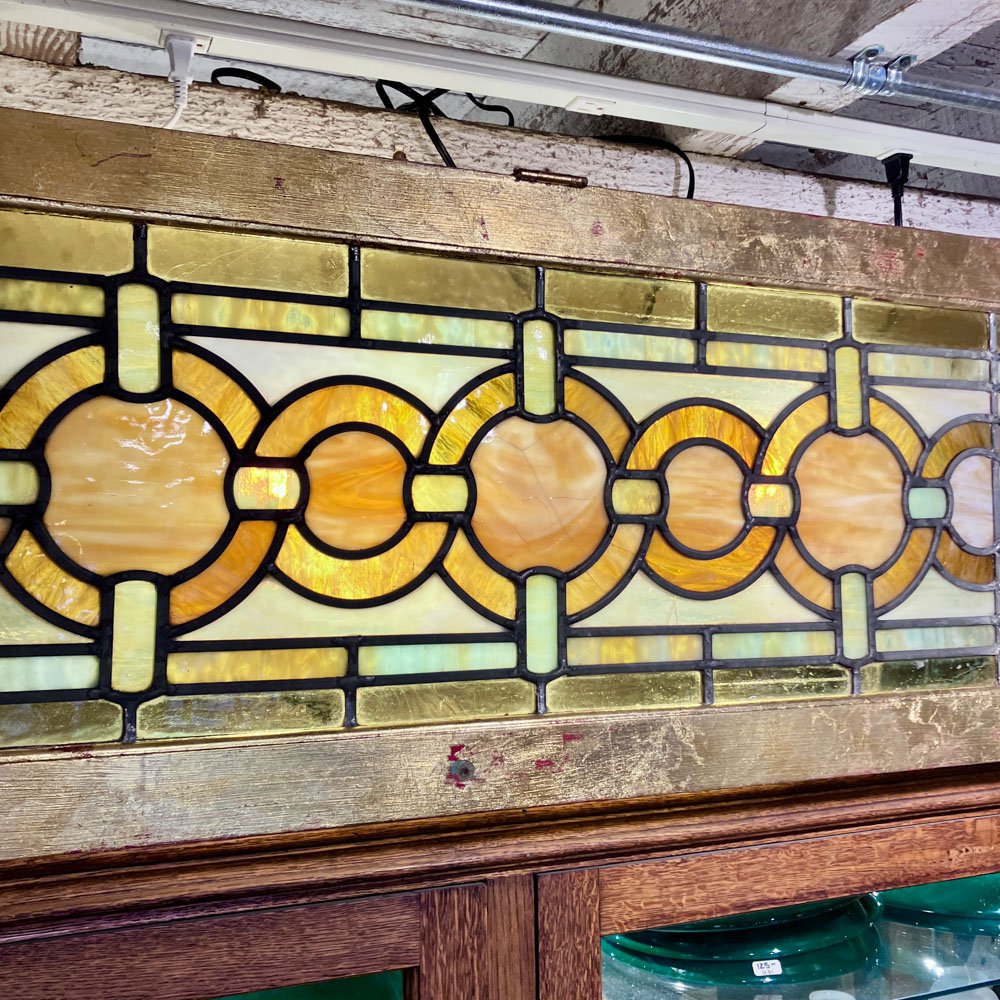 Green and Gold Stained Glass Window with Interwoven Loops and Gold Leafed Frame - Aurora Mills