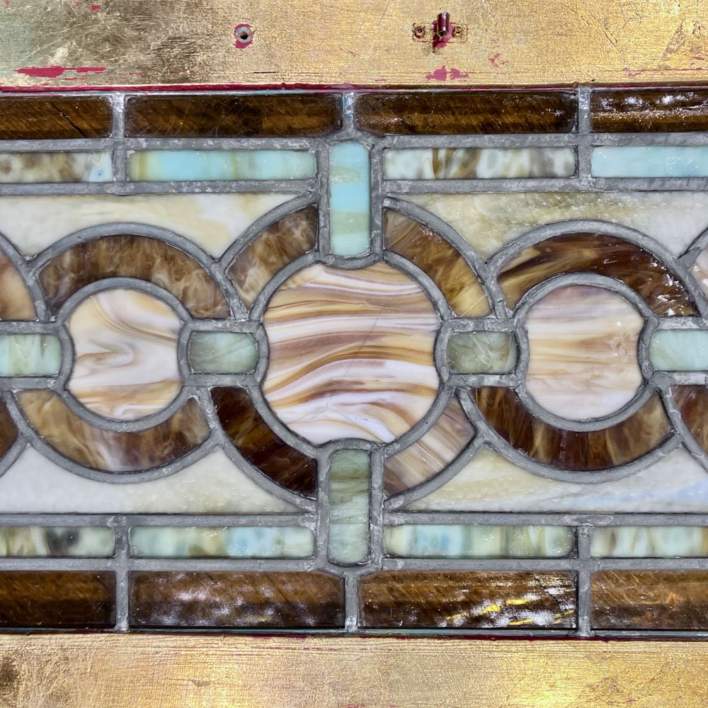 Green and Gold Stained Glass Window with Interwoven Loops and Gold Leafed Frame - Aurora Mills