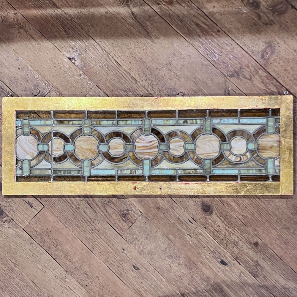 Green and Gold Stained Glass Window with Interwoven Loops and Gold Leafed Frame - Aurora Mills