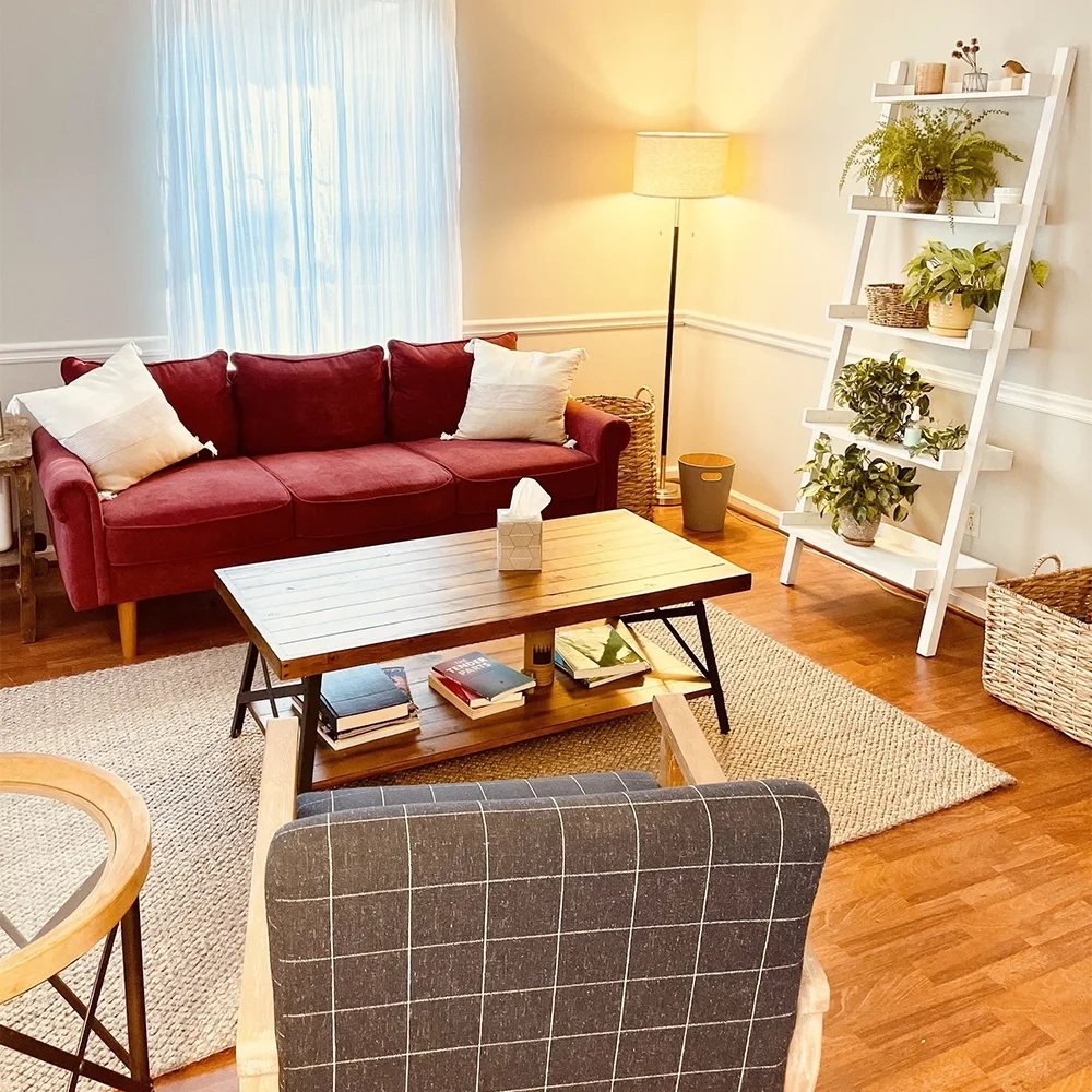 Comfortable therapy room with soft lighting and natural elements in Savannah counseling office