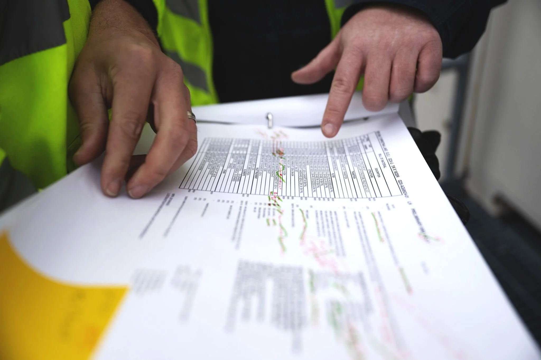 Two men examining paperwork