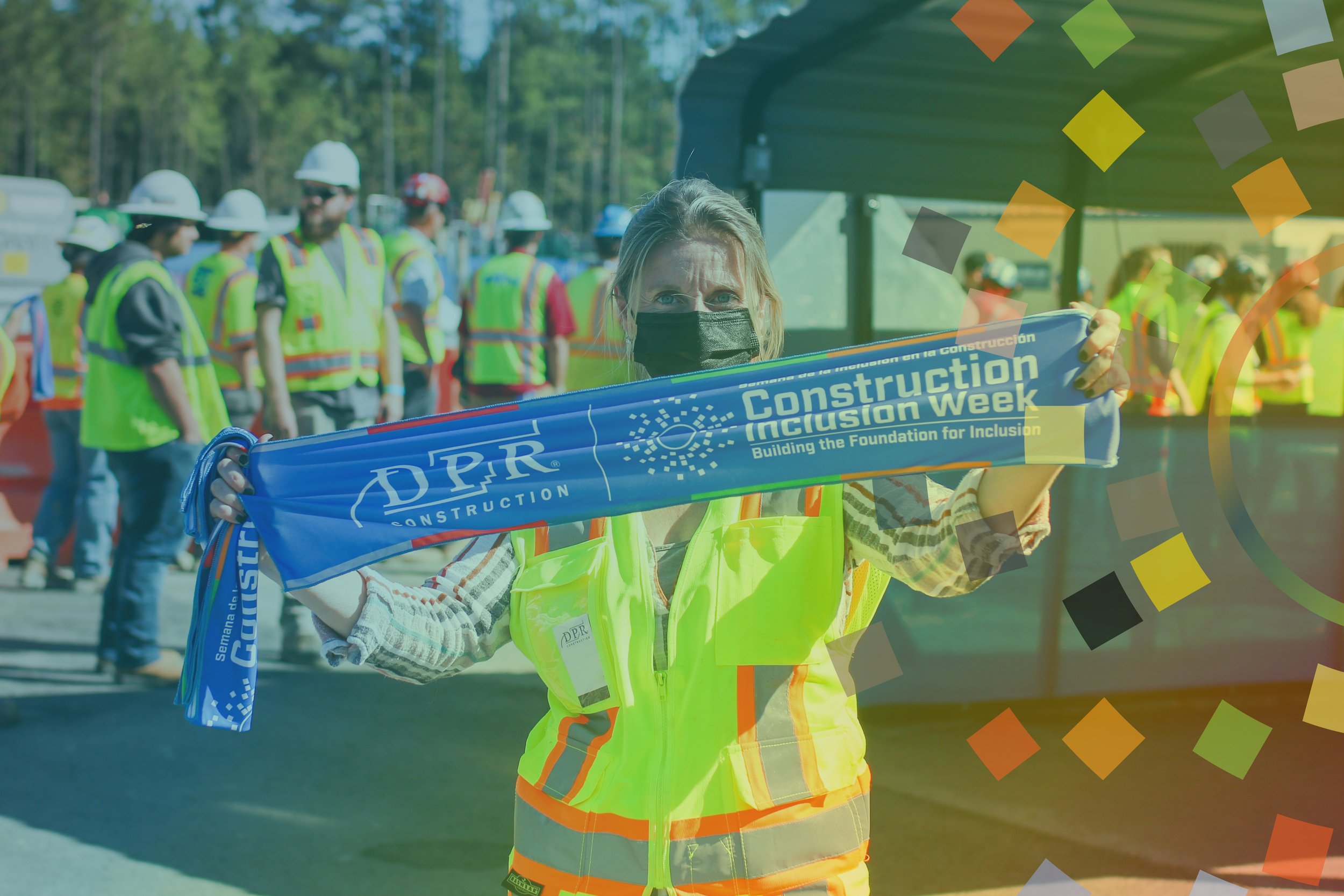 Construction Inclusion Week cooling towel being displayed by a worker wearing a vest.