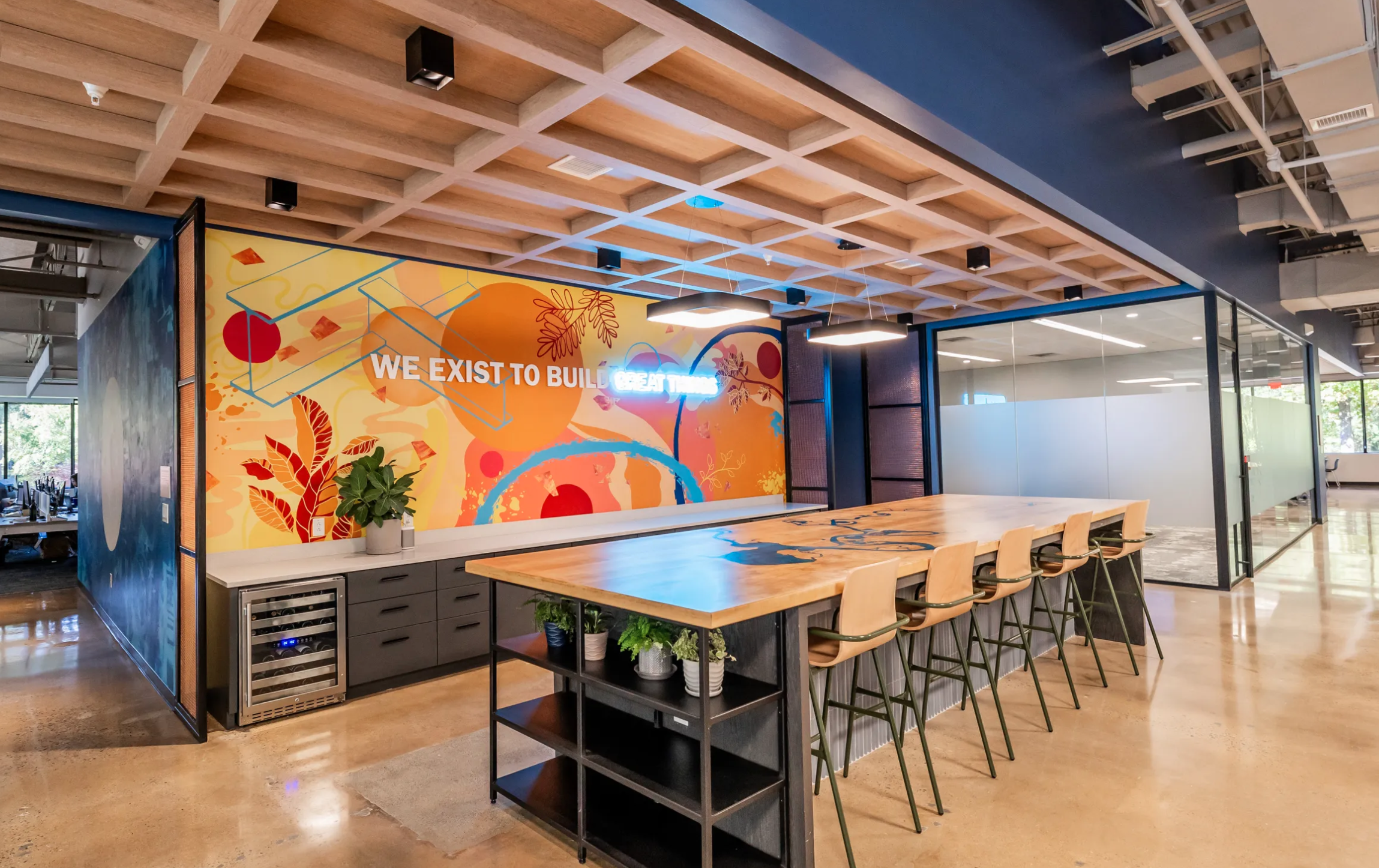 Office break room with bright wall art
