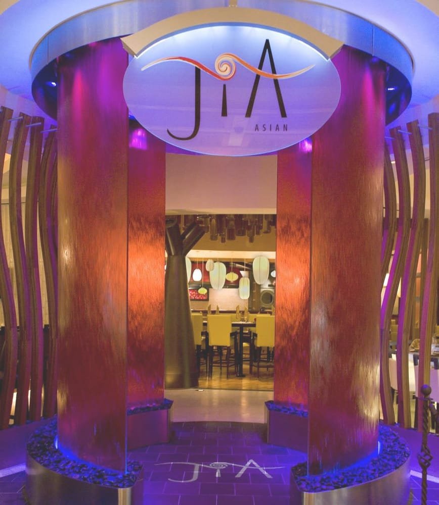 Entrance to Jia Asia with the logo on a sign above and on the tiles below