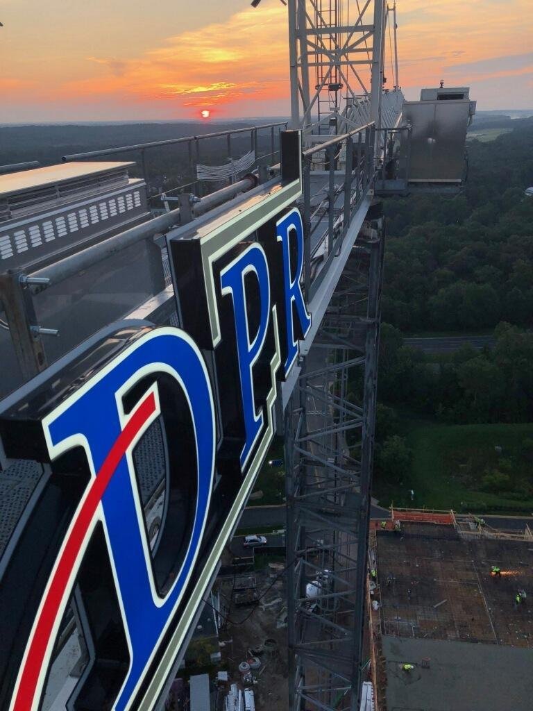 The DPR Construction logo as a crane sign