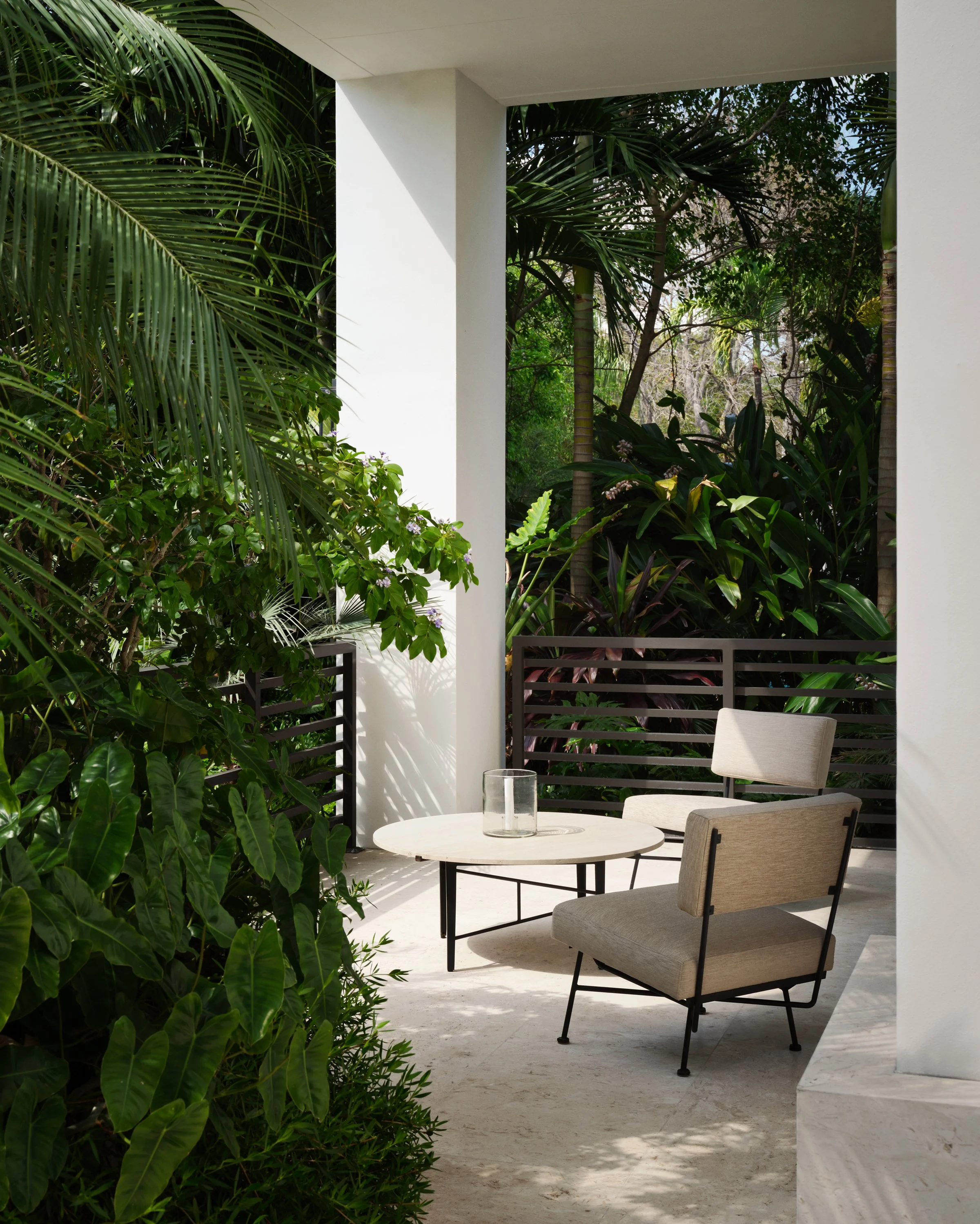 Smaller outdoor seating area with two chairs.