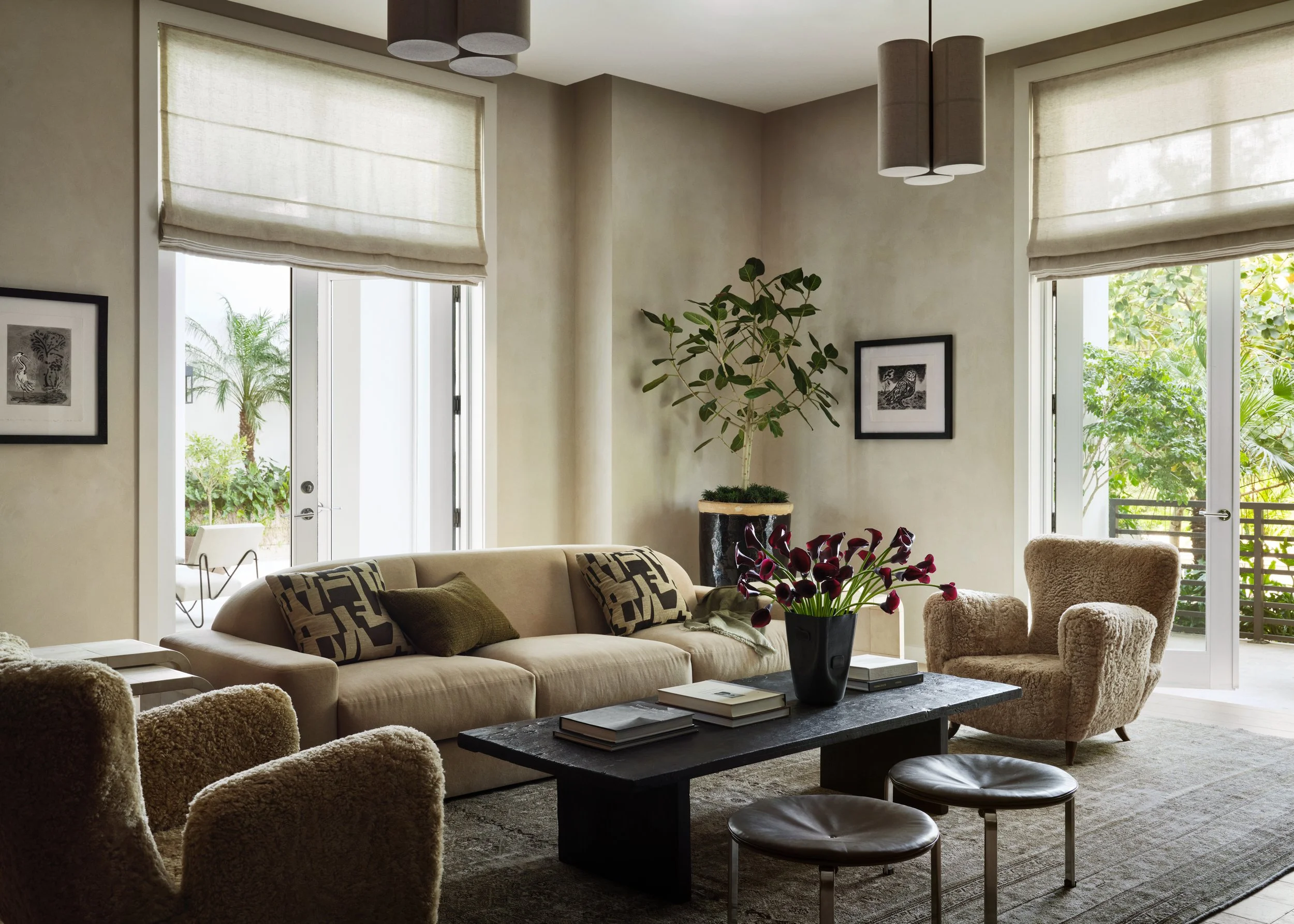View of a different seating area, with sofa, side chairs, coffee table and decor.