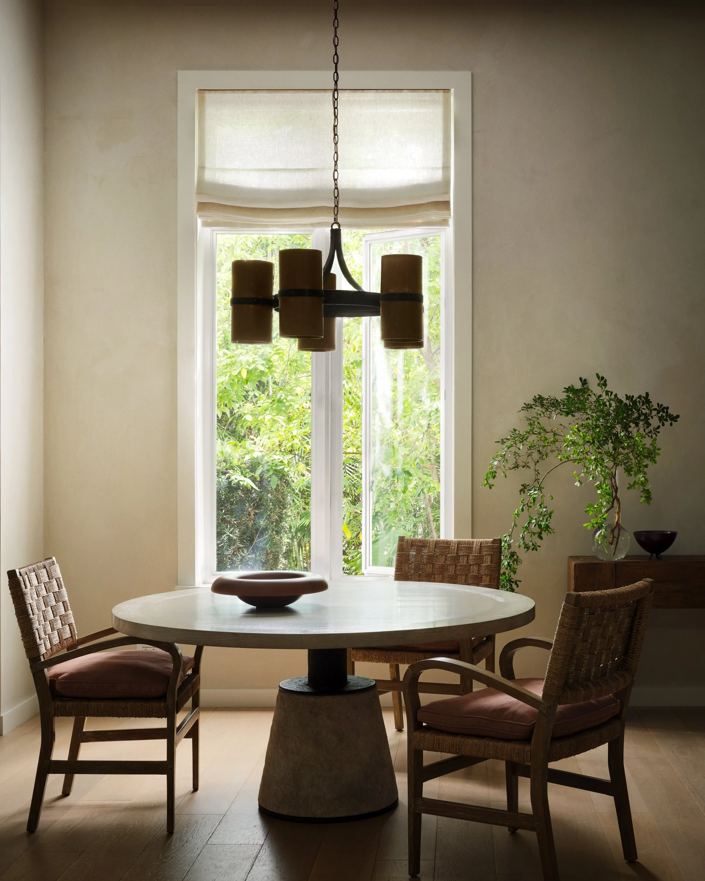 Round breakfast table with three chairs.