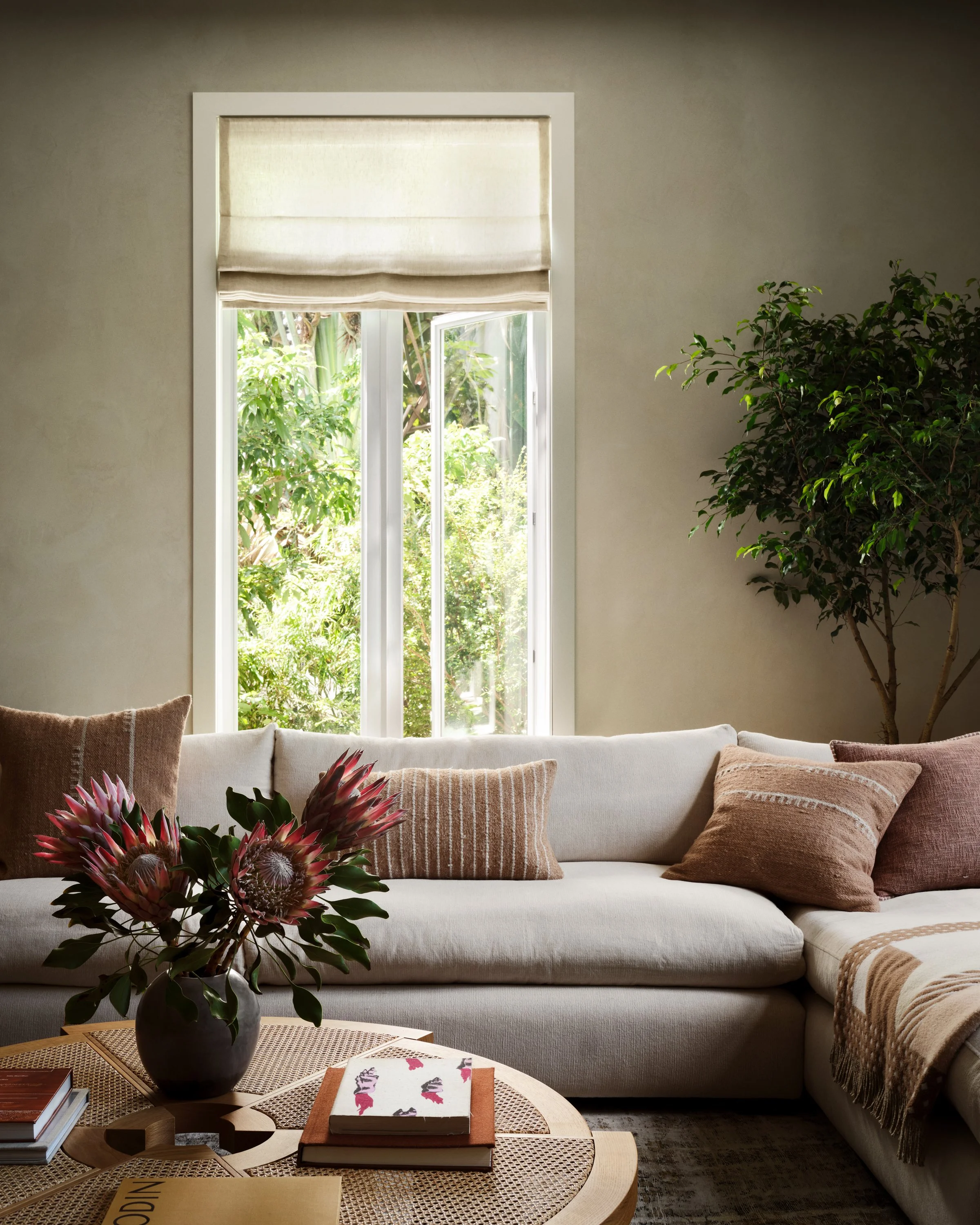 Close-up of l-shaped sofa and coffee table.