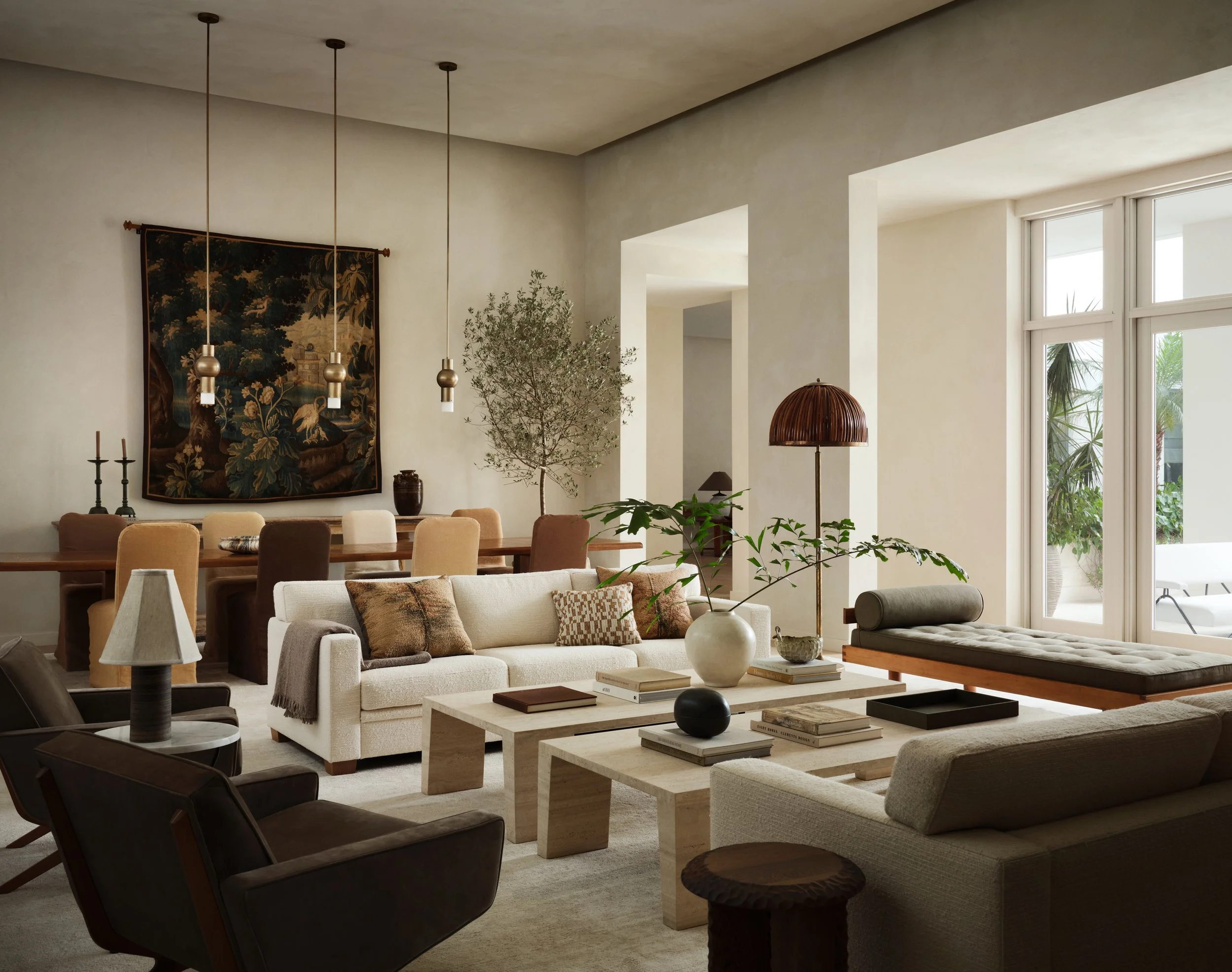 Wide view of seating area and dining table in the back.