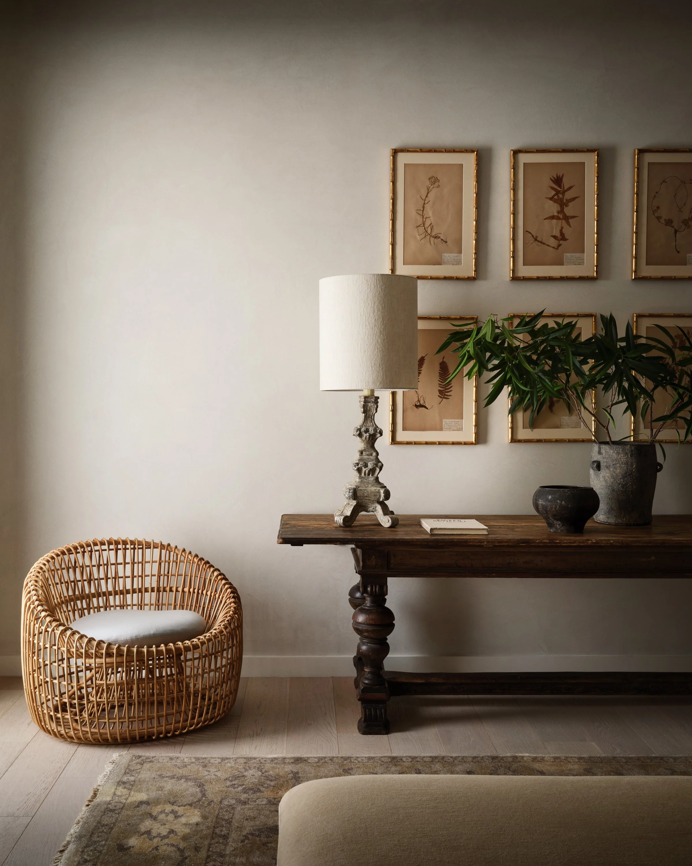 Side table, lamp, artwork, plant and small side chair from the Cocoplum Residence I project.