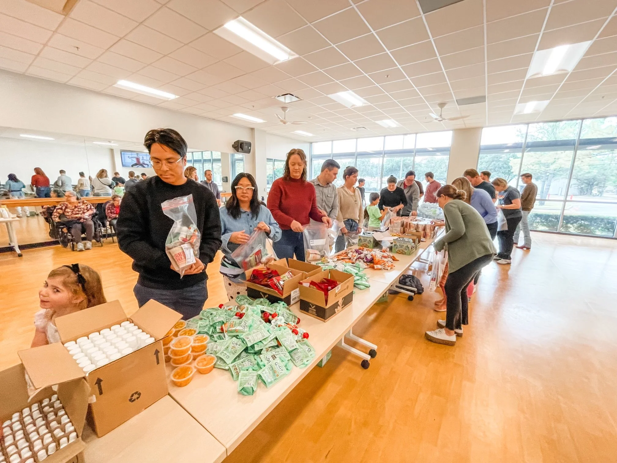 Volunteers serving at a Restore Houston Church community event