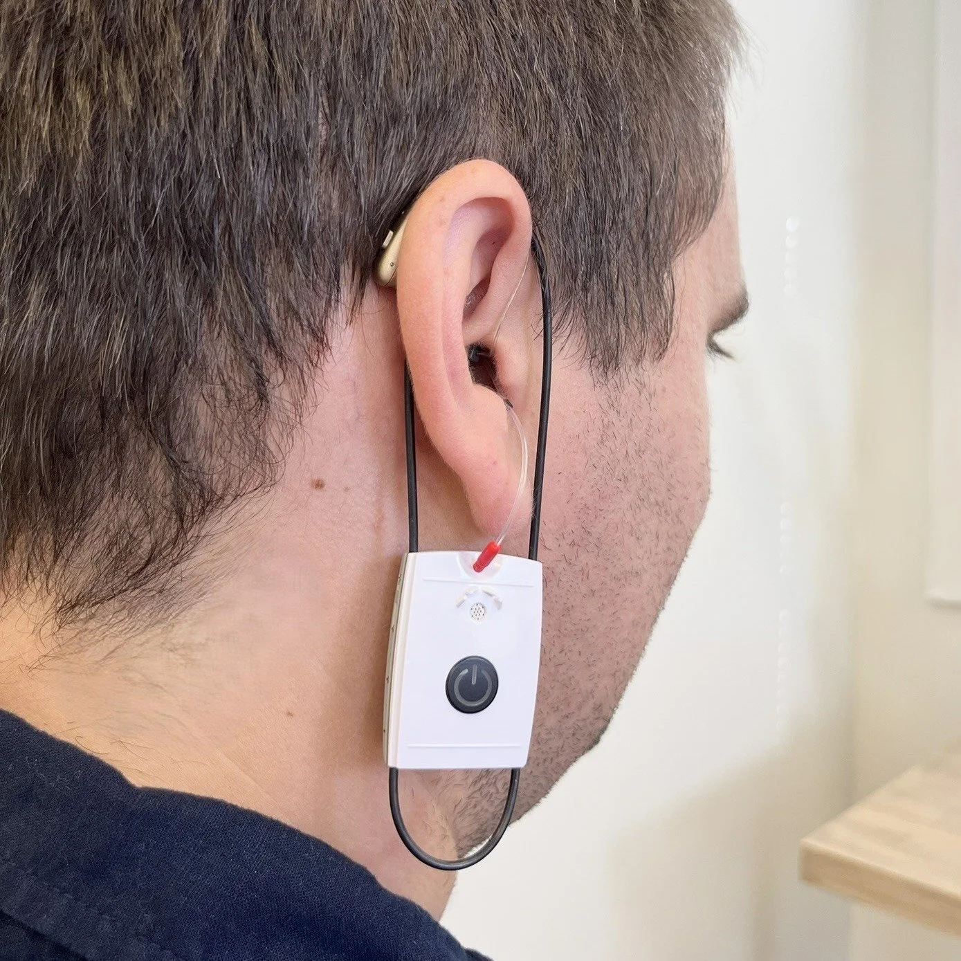No, it&rsquo;s not an earring. It&rsquo;s a tiny microphone used for real ear measurement.

This test lets us measure exactly how your hearing aids perform in your ears so they can be programmed precisely to your hearing needs.

It&rsquo;s the gold s