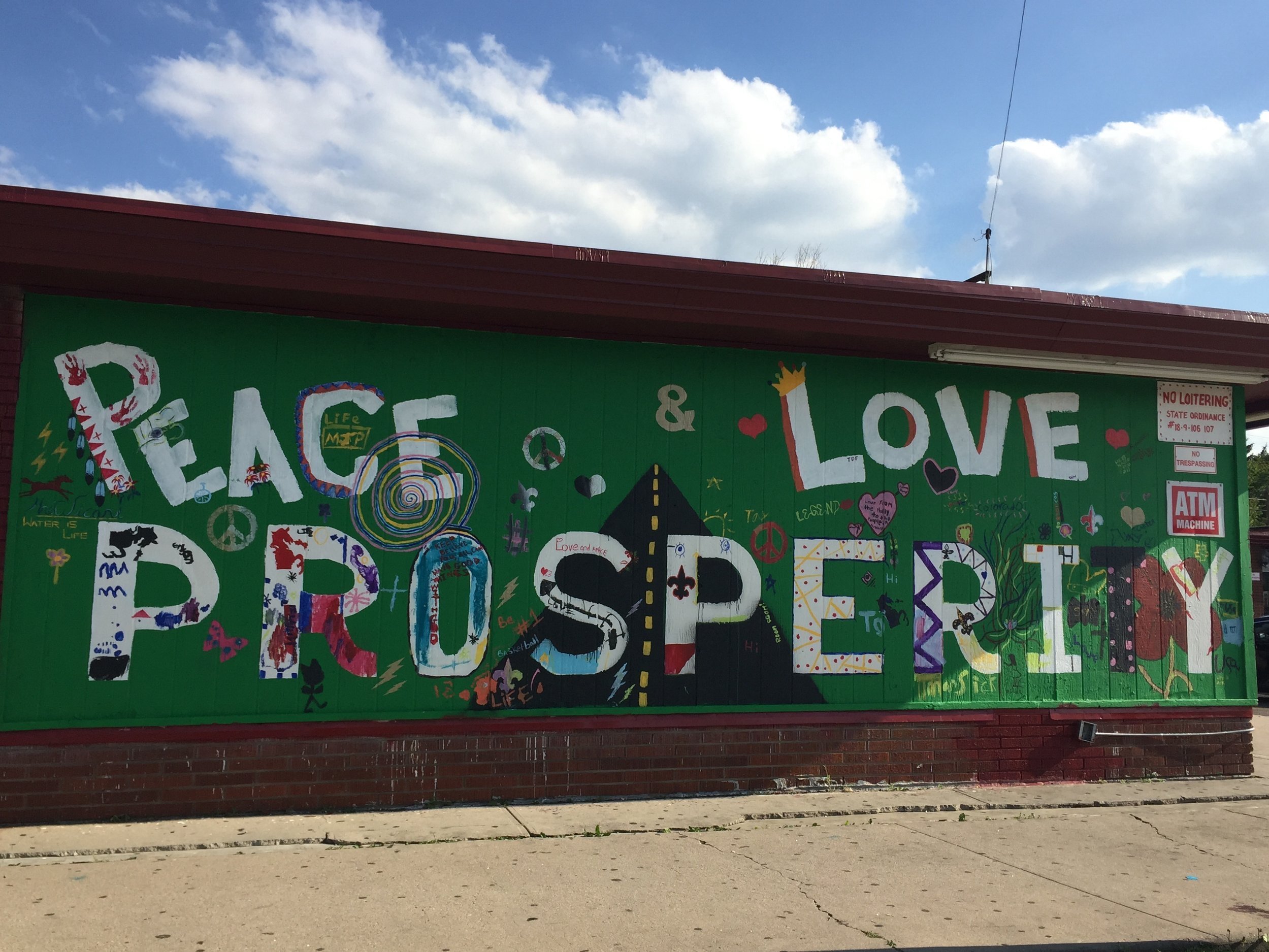 The finished mural maintains the reclamation of a local hang out space. The weekend painting and music event included the entire neighborhood, and facilitated dialogue between neighbors, the neighborhood and the design group.