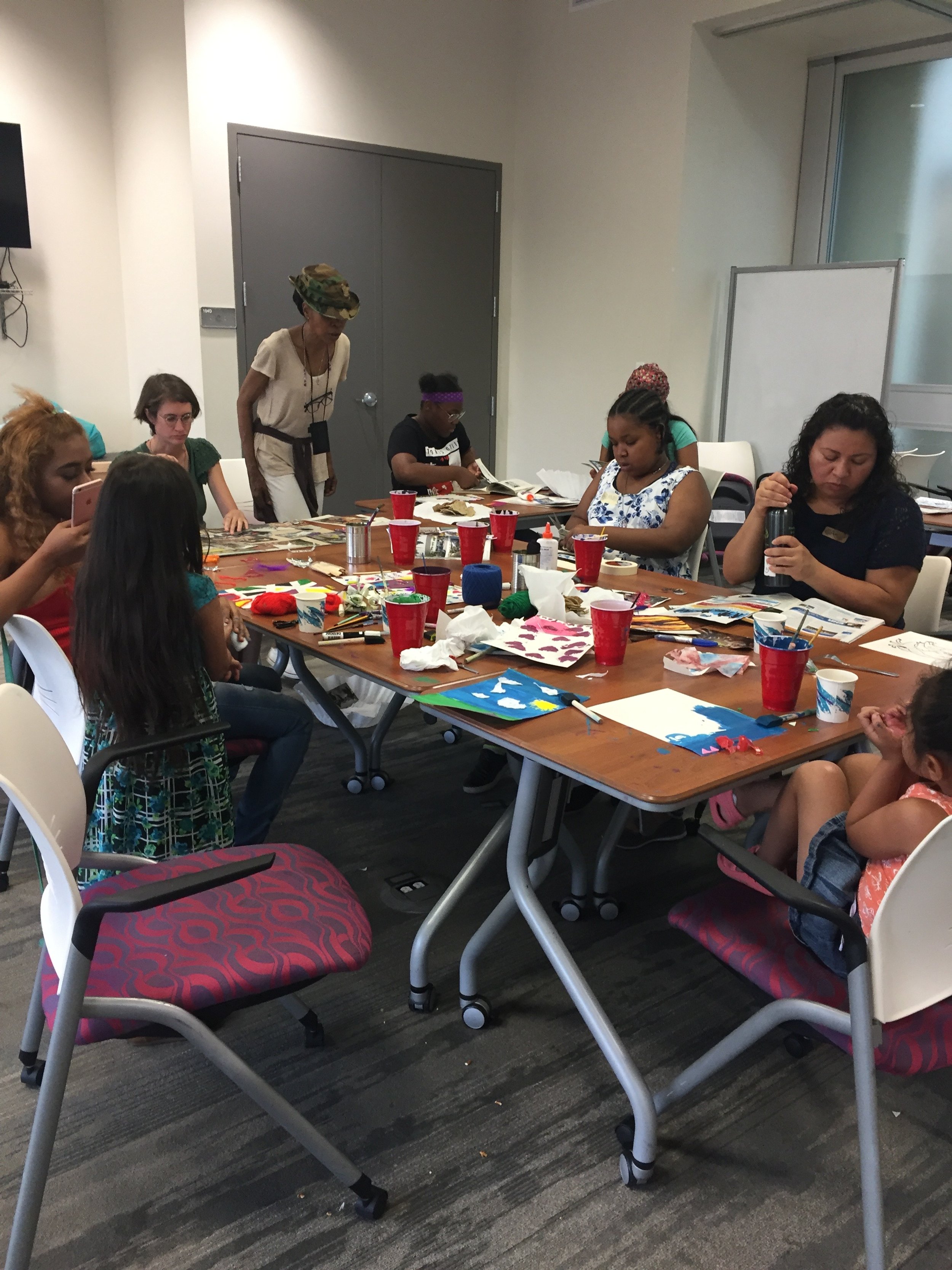 History telling community project. Participants were welcome to draw, paint, write, etc. on an 8x10 canvas. These personal community histories were created at the community resource center and presented to the neighborhood at their opening farmer's