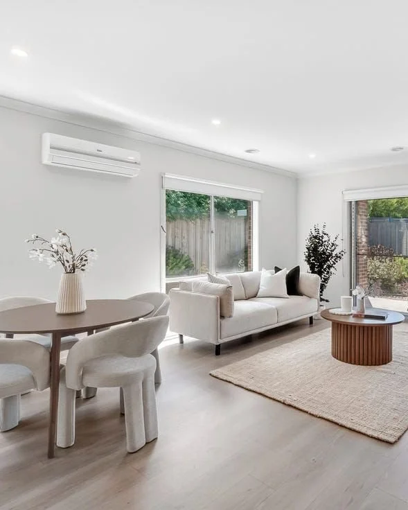 Living &amp; dining with warm walnut tones 🤎

A fresh perspective on a neutral palette, where layered textures, soft furnishings and rich timber accents create a space that feels both calm and inviting. 
Thoughtful property styling helps buyers inst