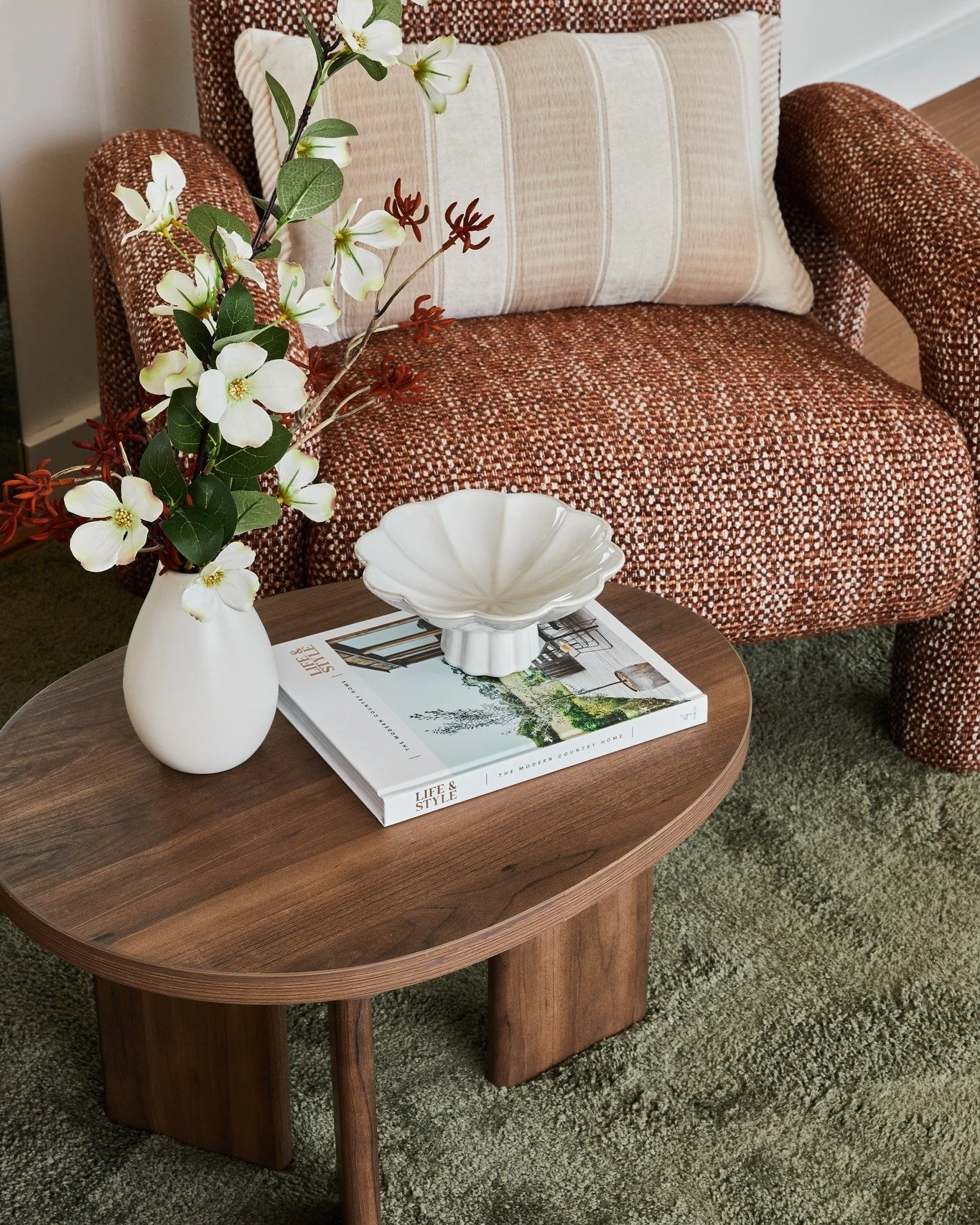 It&rsquo;s all in the details. Layering texture, tone, and form creates moments that feel both styled and lived-in. From the rich warmth of the armchair to the softness of the greenery, every element works together to tell a story.
These are the touc