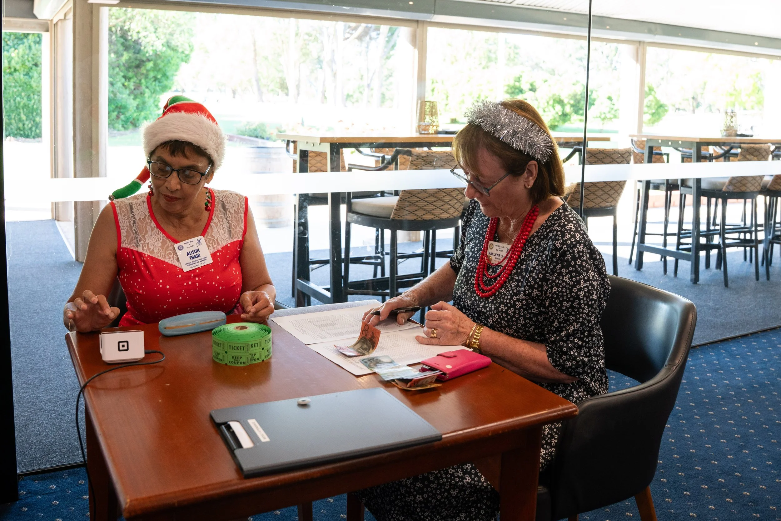 Hard at work on attendance members Alison Thair and Raelene George