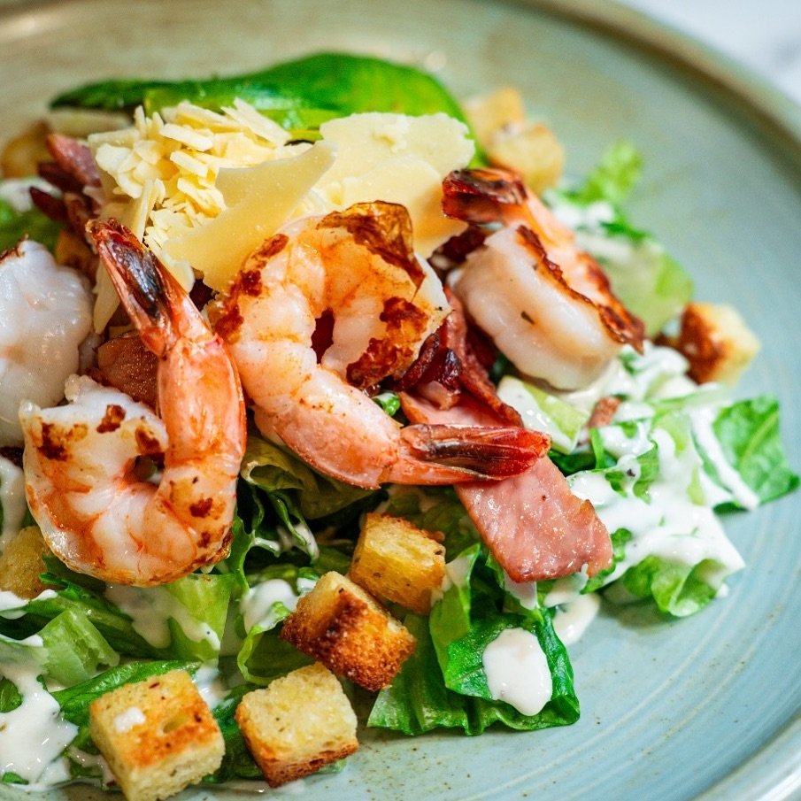 The ultimate Caesar upgrade! Grilled prawns, avocado, &amp; all the classic fixings.
Cos lettuce, crispy bacon, succulent prawns, the works...plus a delicious avocado twist on our classic Caesar. 
You&rsquo;re in for a treat!

To make a booking visit