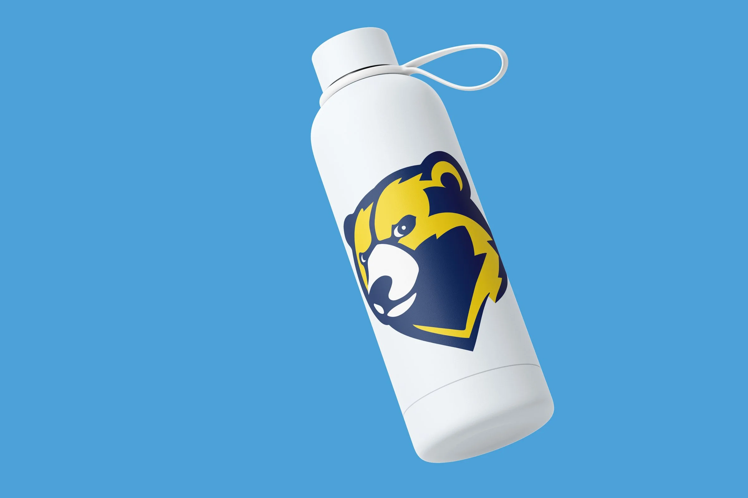White water bottle against a medium blue background. Dark blue and yellow athletic bear symbol for Norwood-Fontbonne Academy is wrapped around bottle.