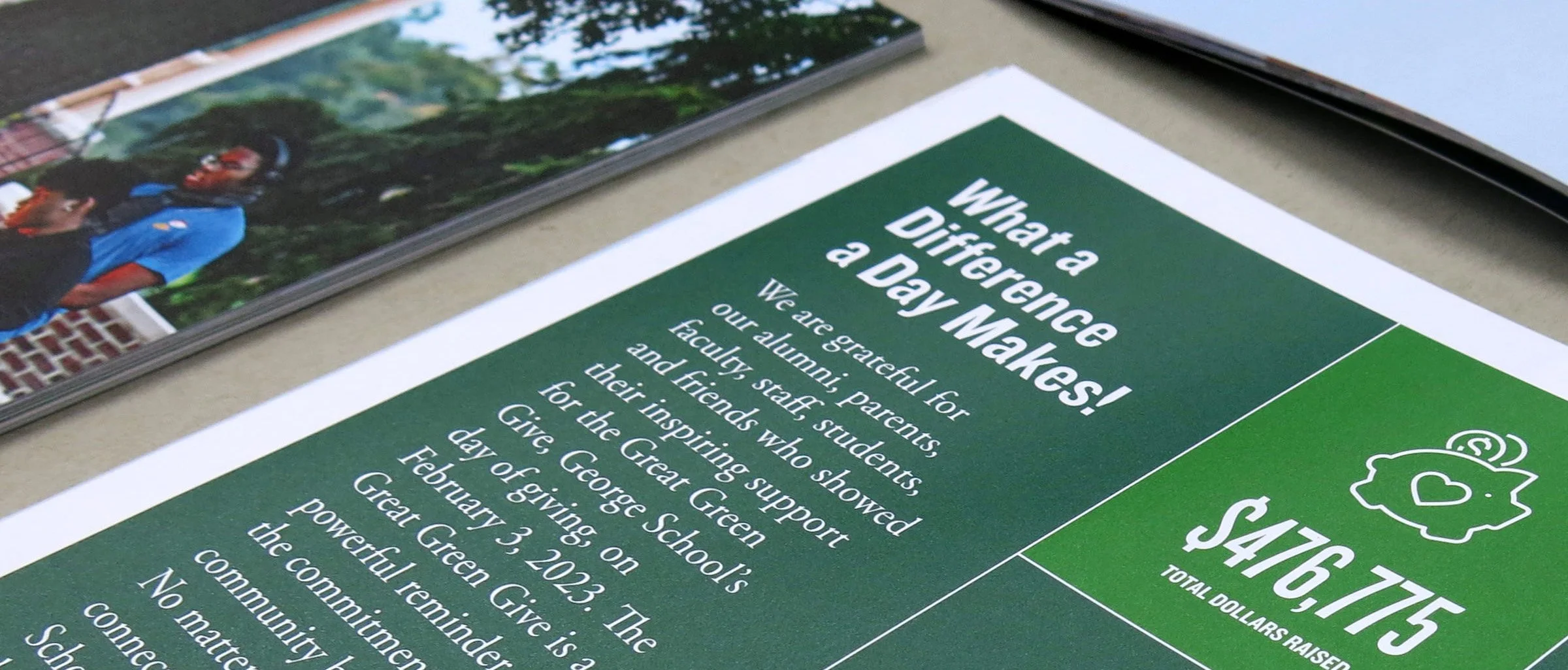 Cropped image of annual report for George School showing white typography against a dark green background.