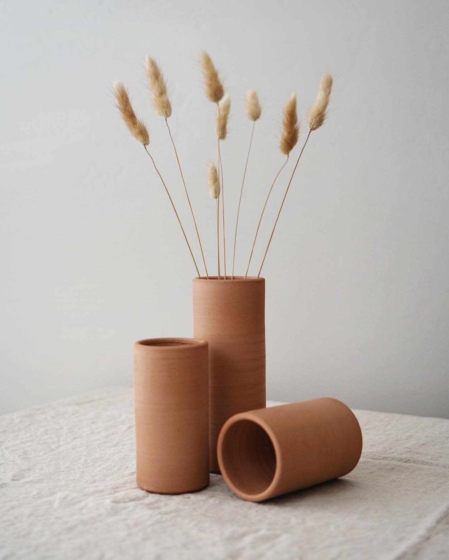 A family of cylinder bud vases (still raw - not yet bisque fired or glazed). Just testing out some styled photos 📷