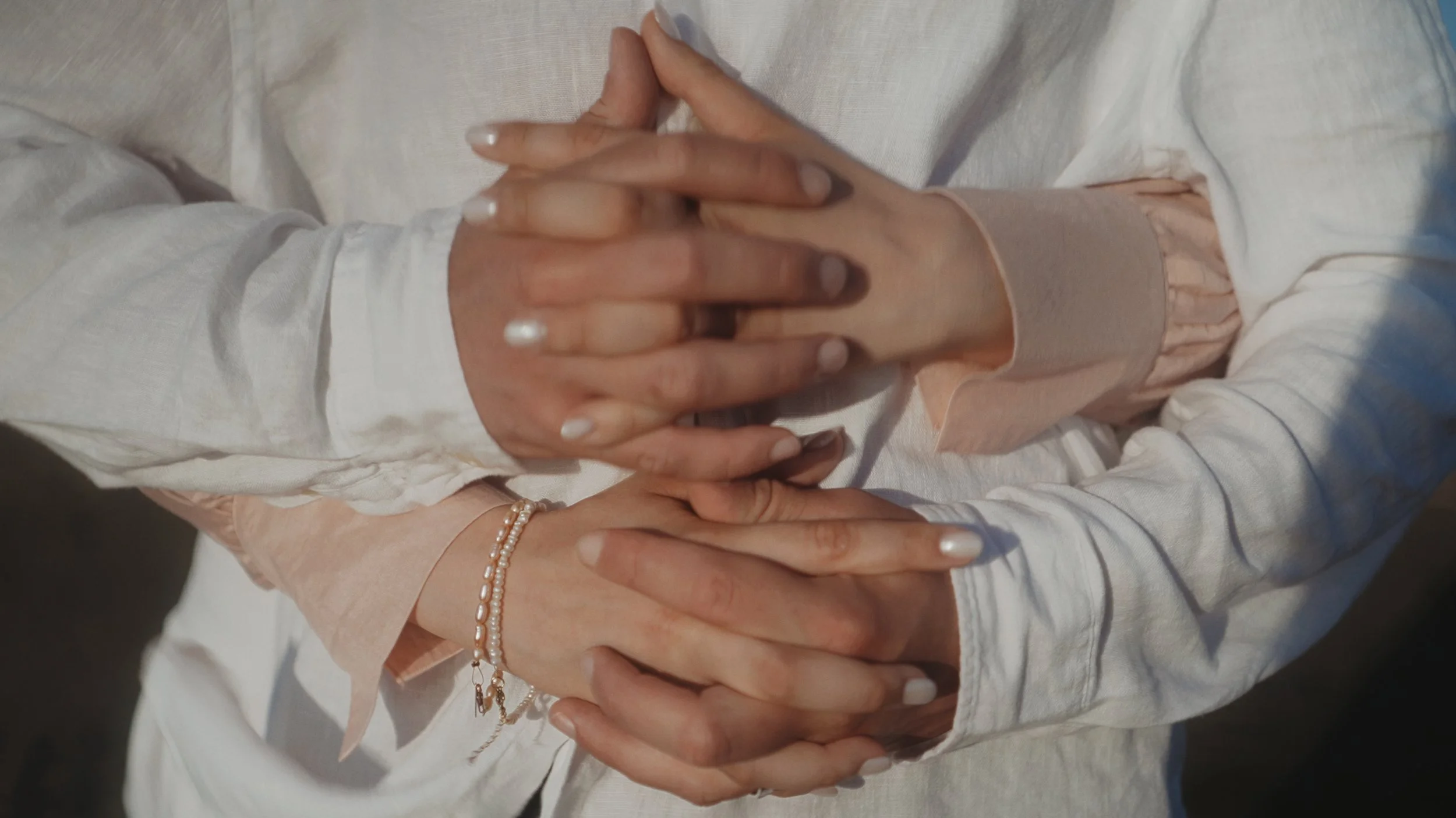 26	Close-up of Evgenia and Geri’s intertwined hands during their couple session in Akrotiri Cyprus, Red Lens Films