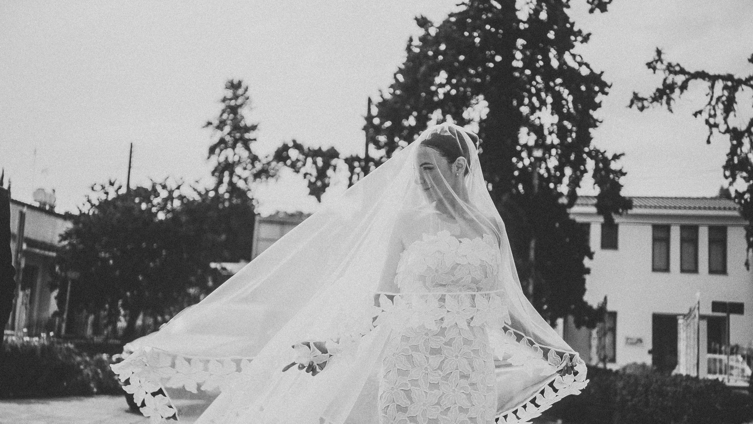 Bride with veil flowing outside church before Greek Orthodox ceremony, Nicosia Cyprus, Red Lens Films