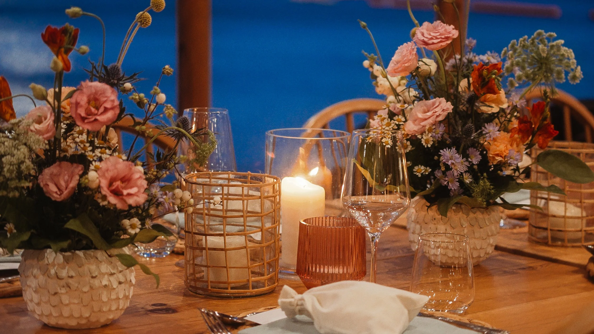 Wedding reception table with wildflowers and candles by the sea at night, Lady's Mile Beach Limassol Cyprus, Red Lens Films