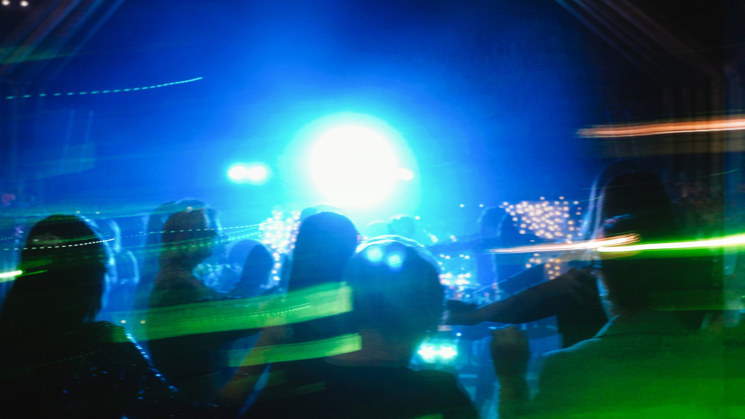Guests dancing on dance floor with blue and green lights and motion blur, Charidio Venue Choirokoitia Cyprus, Red Lens Films
