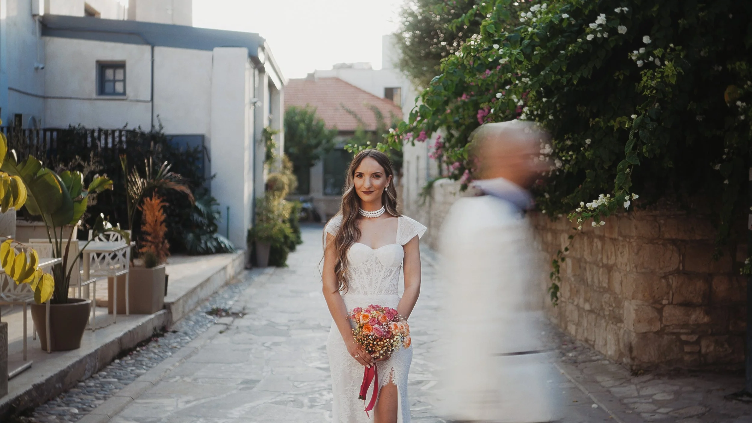 ride holding colourful bouquet in old town street with bougainvillea, couple portrait Limassol Cyprus, Red Lens Films