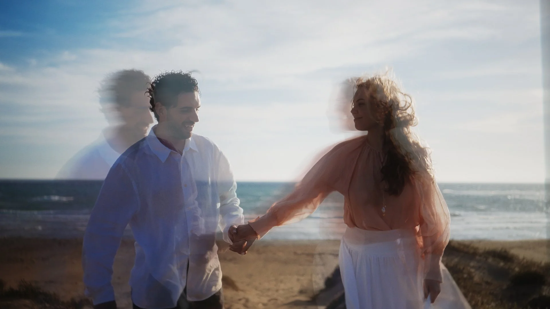 Double exposure of Evgenia and Geri holding hands on the beach at Akrotiri, Cyprus, Red Lens Films