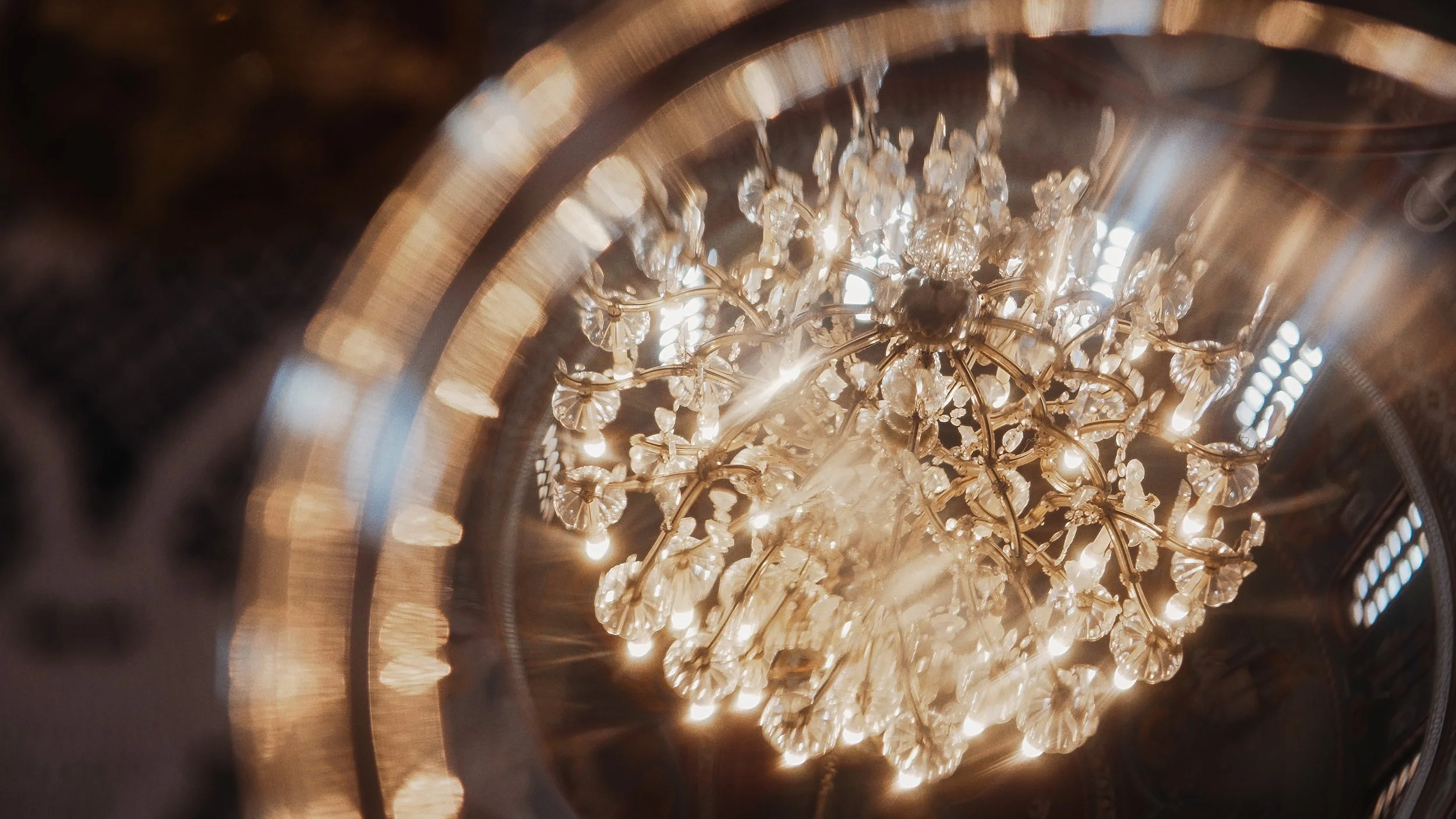 Crystal chandelier inside Ayioi Omoloyites church during Greek Orthodox wedding, Nicosia Cyprus, Red Lens Films