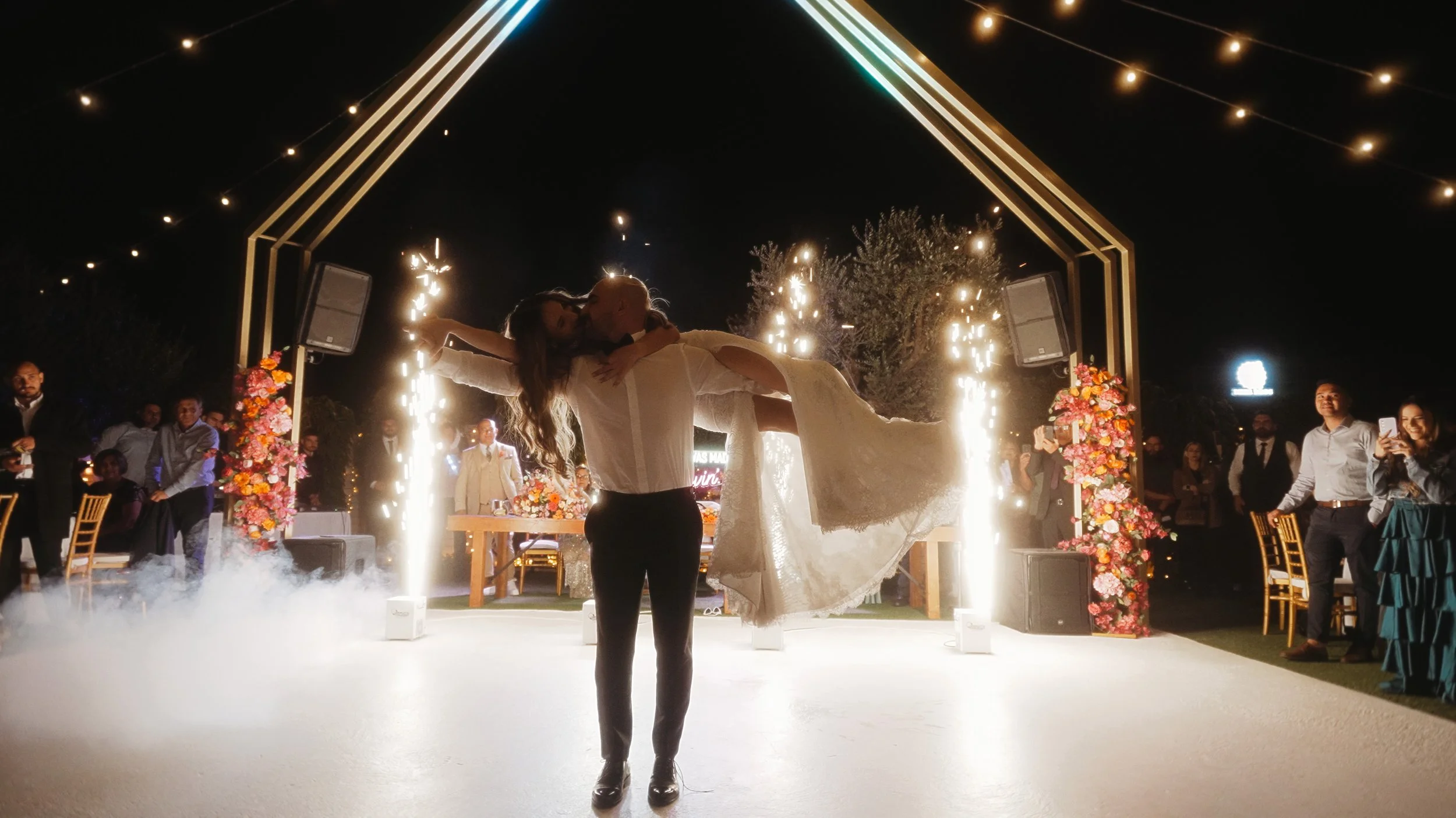 Groom lifting bride during bachata first dance with ground fireworks, Charidio Venue Choirokoitia Cyprus, Red Lens Films