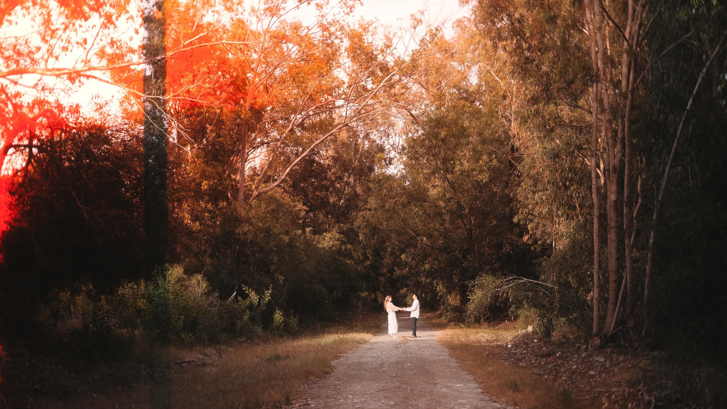 Couple on a forest road in Akrotiri with a red film light leak, Cyprus couple session, Red Lens Films