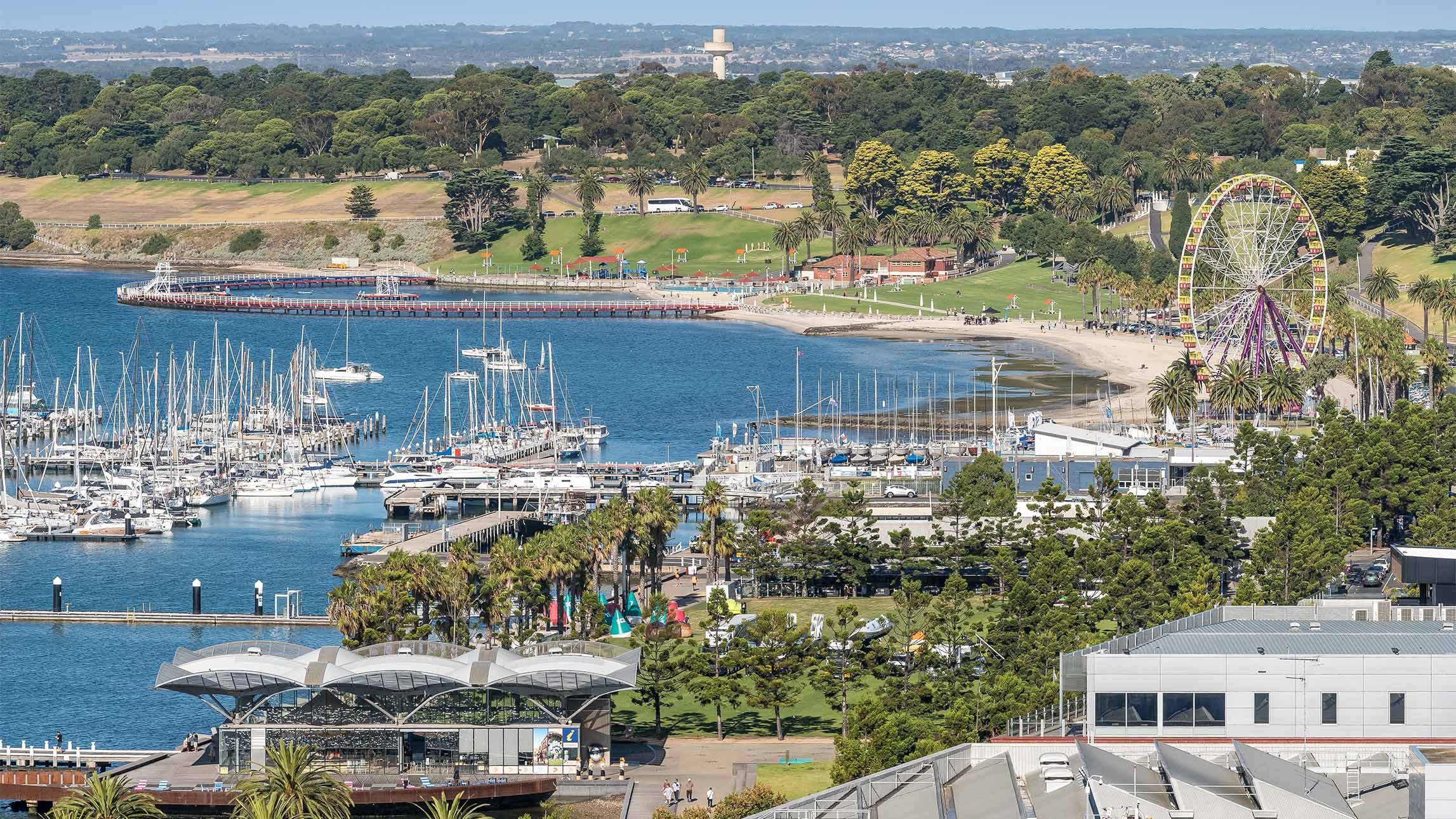 Scenic Geelong Waterfront: Sunny Day with Ferris Wheel, Boats, and Picturesque Views.