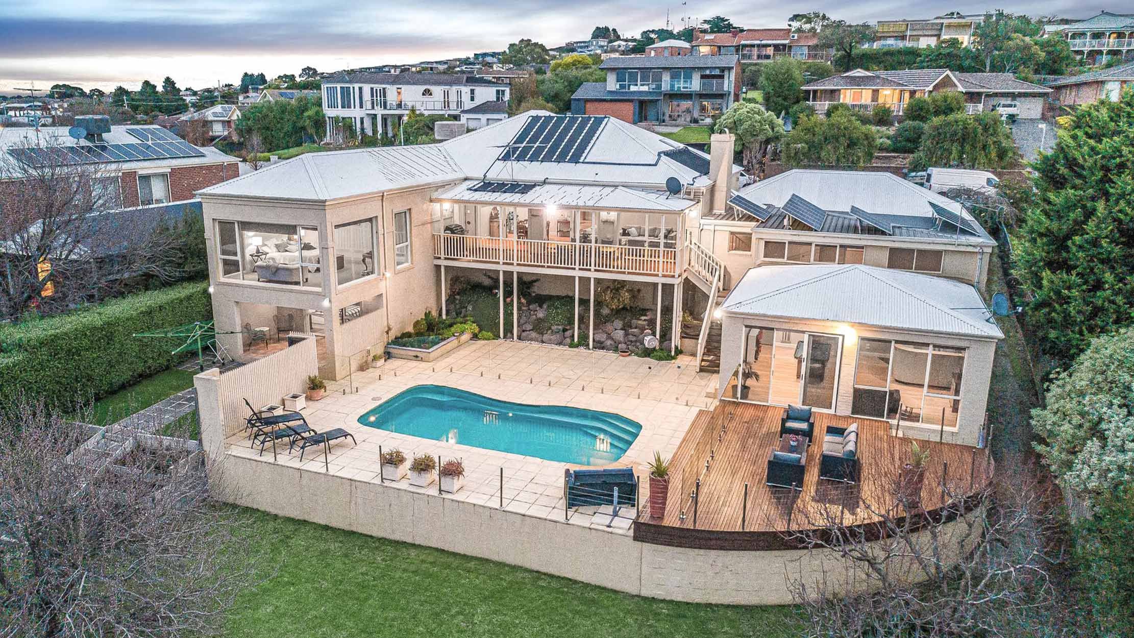 Aerial Marvel: Panoramic View of Wandana Heights Mansion and its Pool Haven.