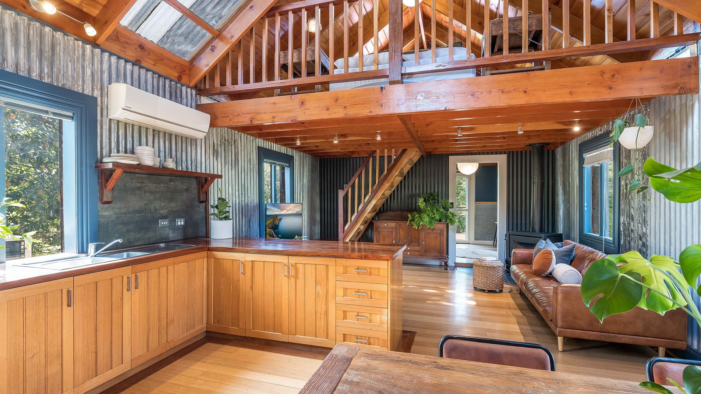 Distinctive Character: Embellished with Exposed Wooden Beams, Discover a Well-Appointed Kitchen and a Tranquil Bedroom Upstairs.