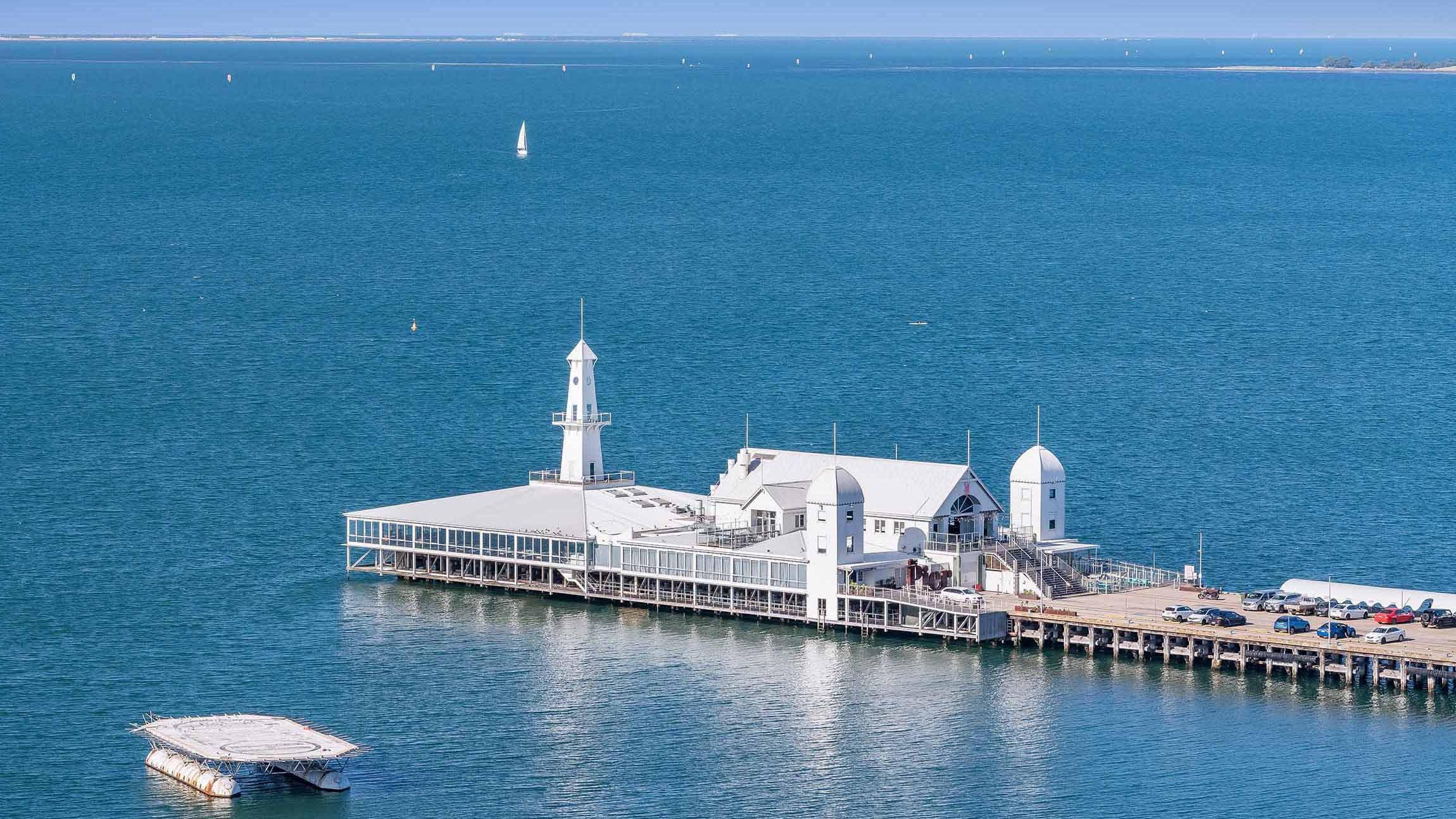 Iconic Geelong Pier Basks in Sun's Glow: Captivating View from the Balcony.