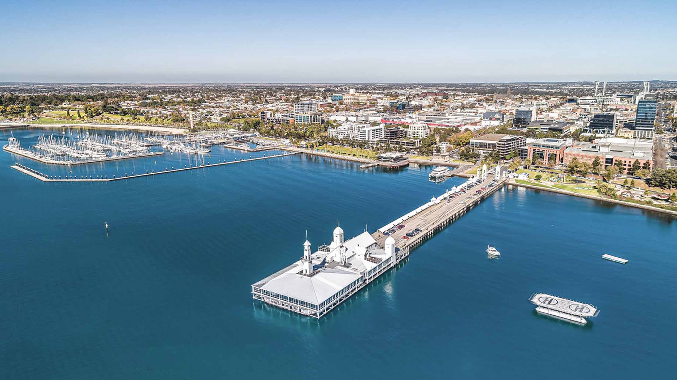 Geelong's Maritime Jewel: Aerial View of Iconic Pier, Gazing Back from Bay to Waterfront.