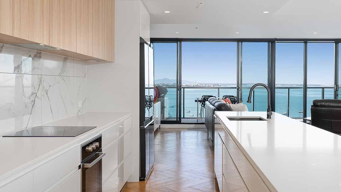 Kitchen Refinement: White Gallery with Blue Bay Panorama.