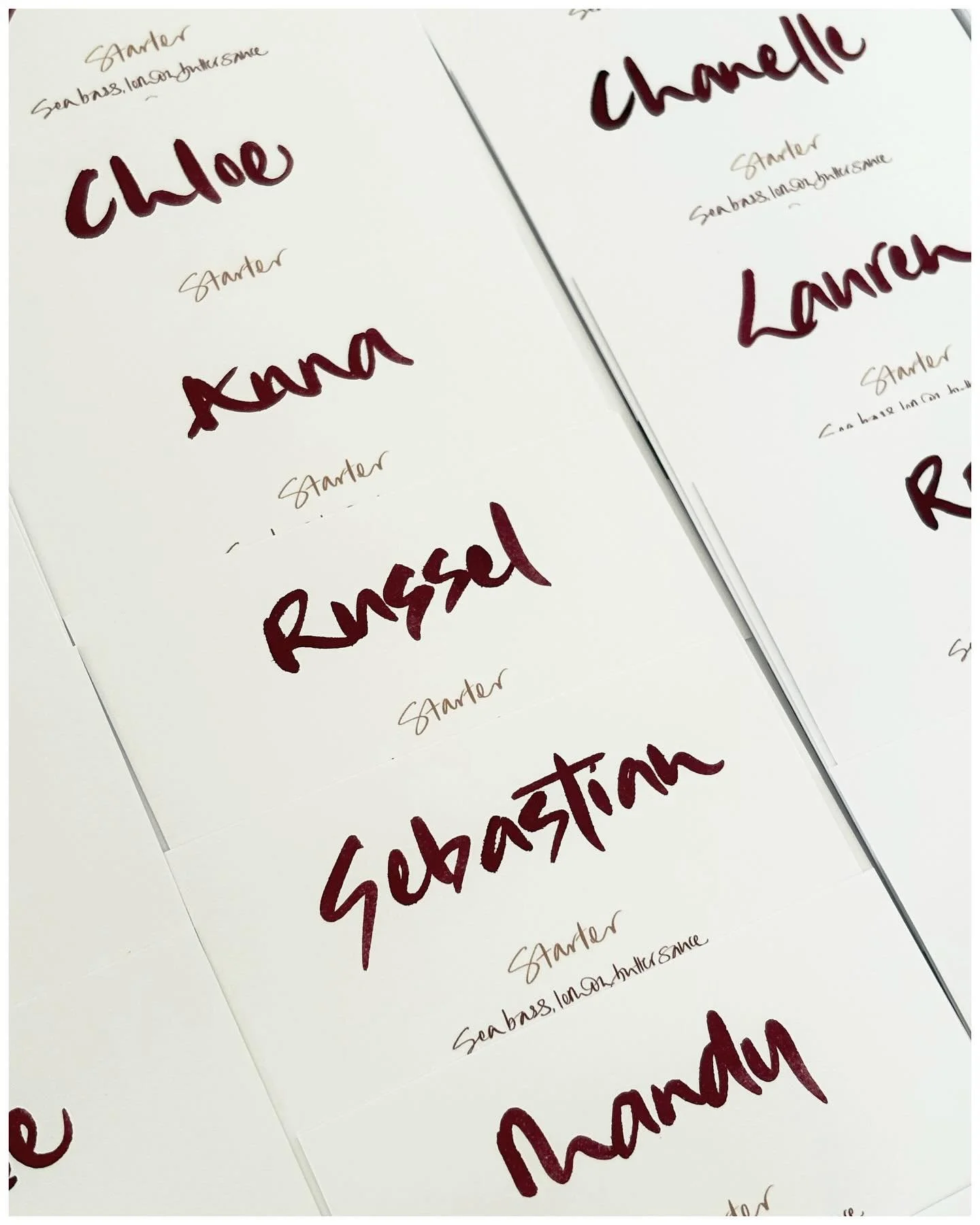 Personalised menus as place settings for a very gorgeous wedding. Josh &amp; Lucy wanted something striking yet relaxed - and brush is a firm favourite for this style of look. I designed the menus on my iPad using a fine nib brush tool and once print