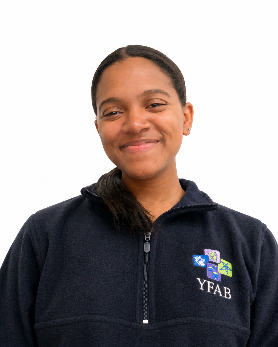 A young woman with dark hair in a ponytail, smiling, wearing a navy blue fleece jacket with a YFAB logo on the chest, standing against a plain white background.